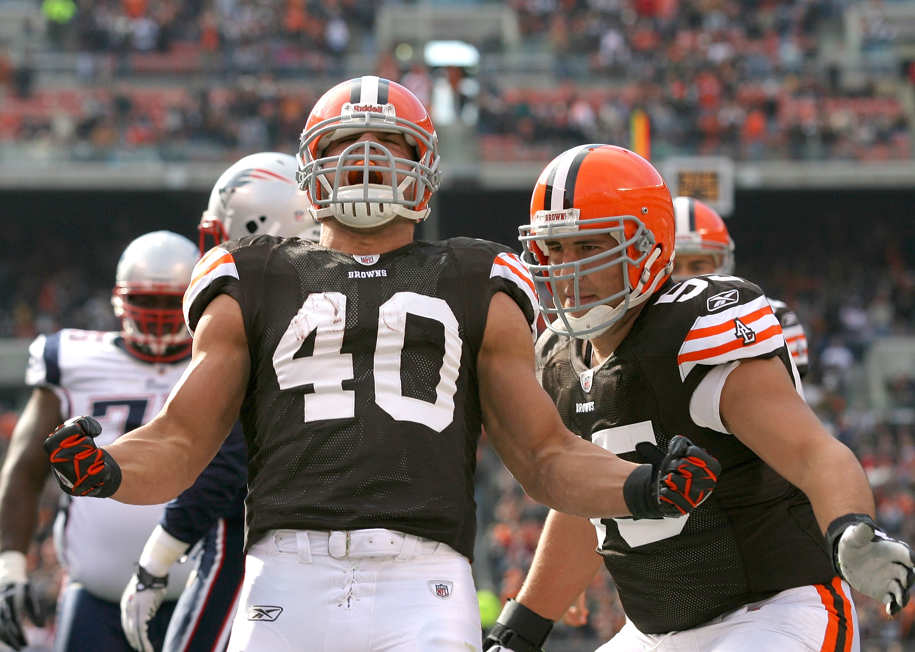 CLEVELAND - NOVEMBER 07:  Running back Peyton Hillis #40 and Alex Mack #55 of the Cleveland Browns celebrate after a touchdown against the New England Patriots at Cleveland Browns Stadium on November 7, 2010 in Cleveland, Ohio.  (Photo by Matt Sullivan/Ge