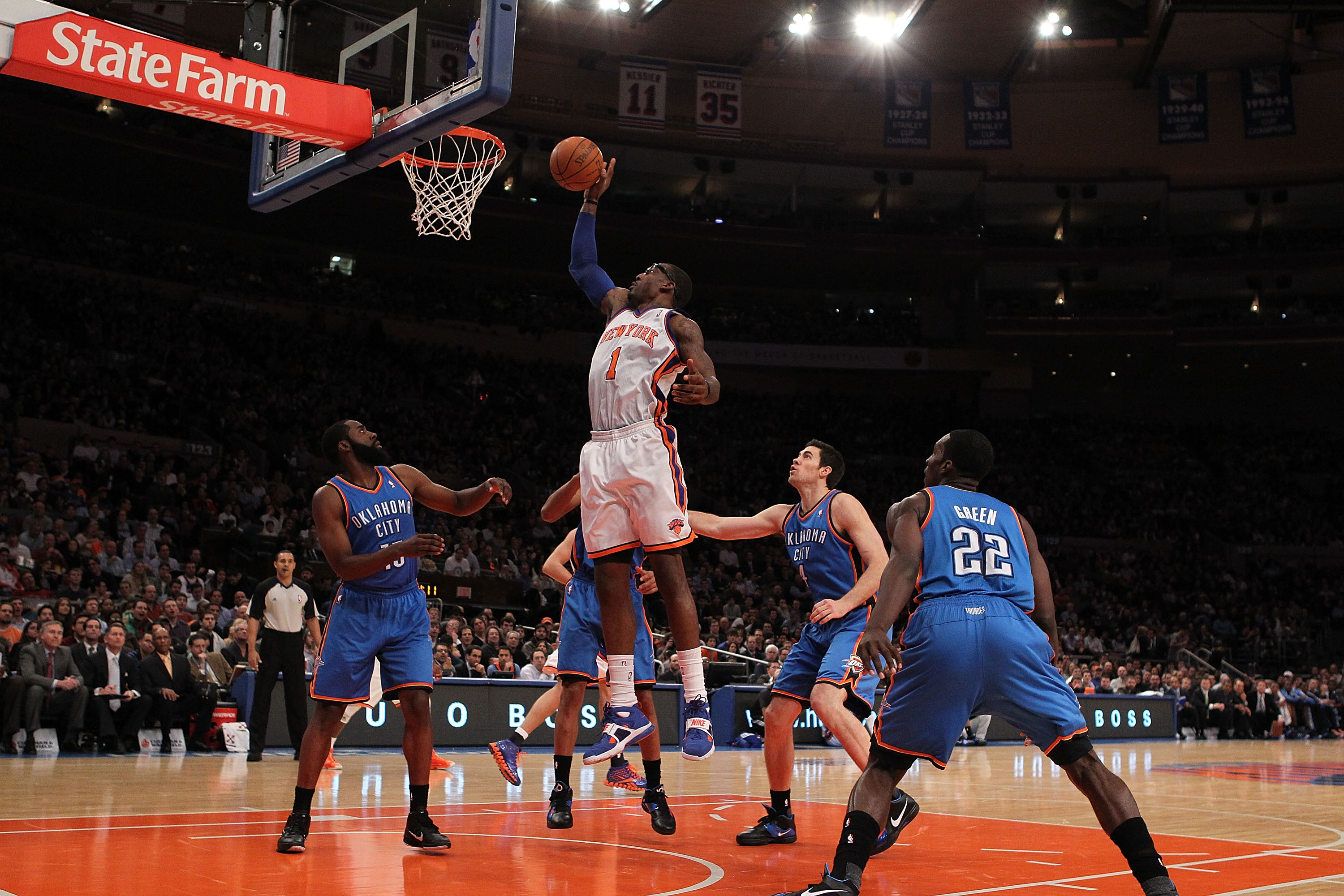 NEW YORK - DECEMBER 22:  Amar'e Stoudemire #1 of the New York Knicks rebounds the ball against  the Oklahoma City Thunder at Madison Square Garden on December 22, 2010 in New York, New York.   NOTE TO USER: User expressly acknowledges and agrees that, by