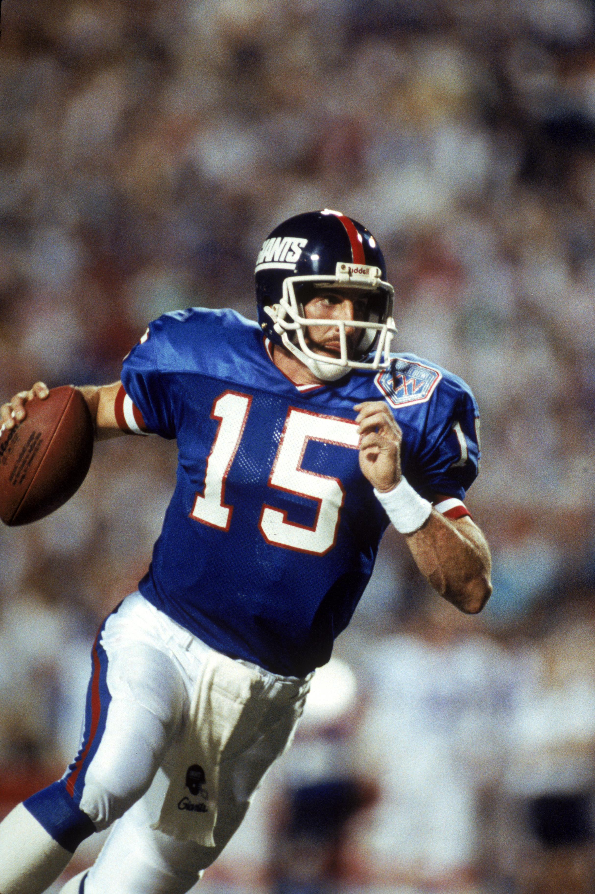 TAMPA, FL - JANUARY 27:  Quarterback Jeff Hostetler #15 of the New York Giants rolls out against the Buffalo Bills during Super Bowl XXV at Tampa Stadium on January 27, 1991 in Tampa, Florida. The Giants defeated the Bills 20-19.  (Photo by George Rose/Ge