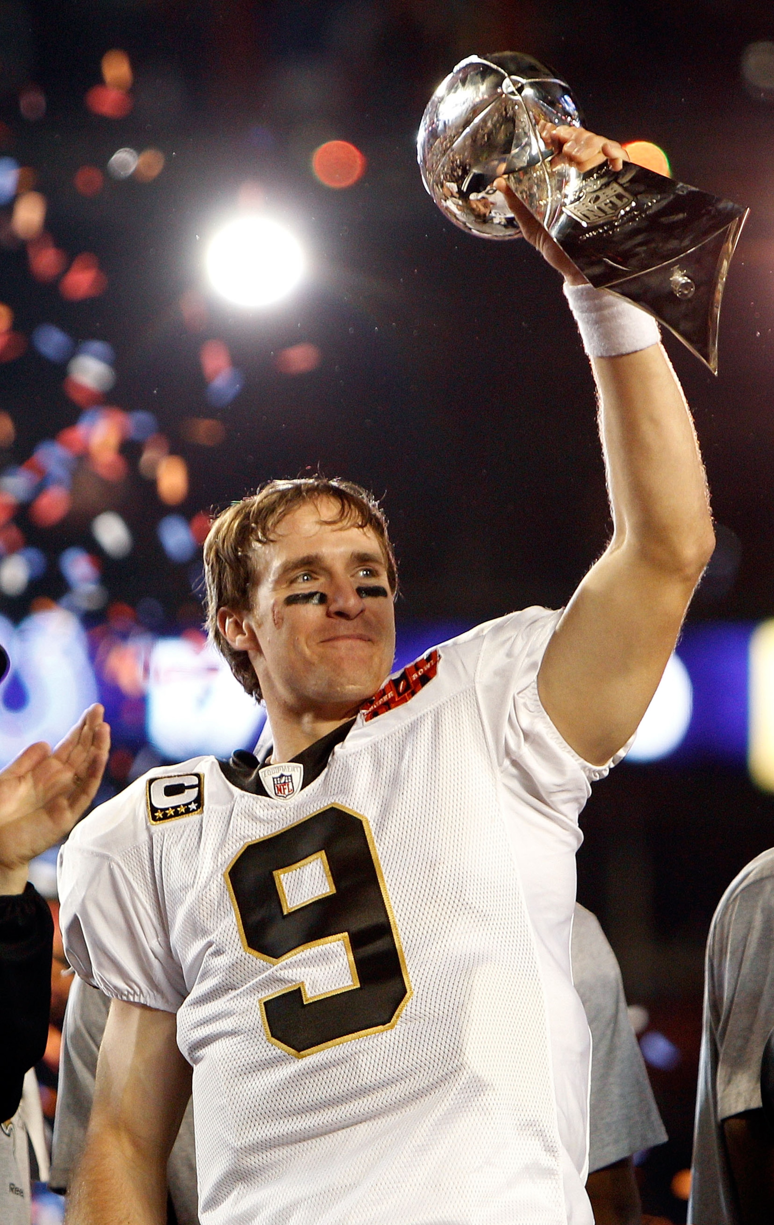MIAMI GARDENS, FL - FEBRUARY 07:  Drew Brees #9 of the New Orleans Saints holds up the Vince Lombardi Trophy after defeating  the Indianapolis Colts during Super Bowl XLIV on February 7, 2010 at Sun Life Stadium in Miami Gardens, Florida. The Saints defea