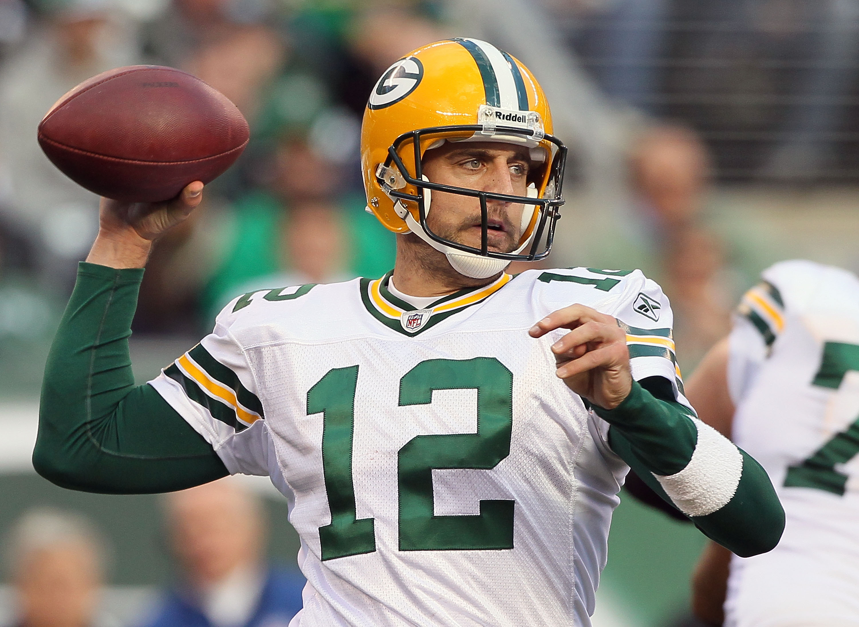 EAST RUTHERFORD, NJ - OCTOBER 31: Aaron Rodgers #12 of the Green Bay Packers throws a pass against the New York Jets on October 31, 2010 at the New Meadowlands Stadium in East Rutherford, New Jersey.The Packers defeated the Jets 9-0. (Photo by Jim McIsaac