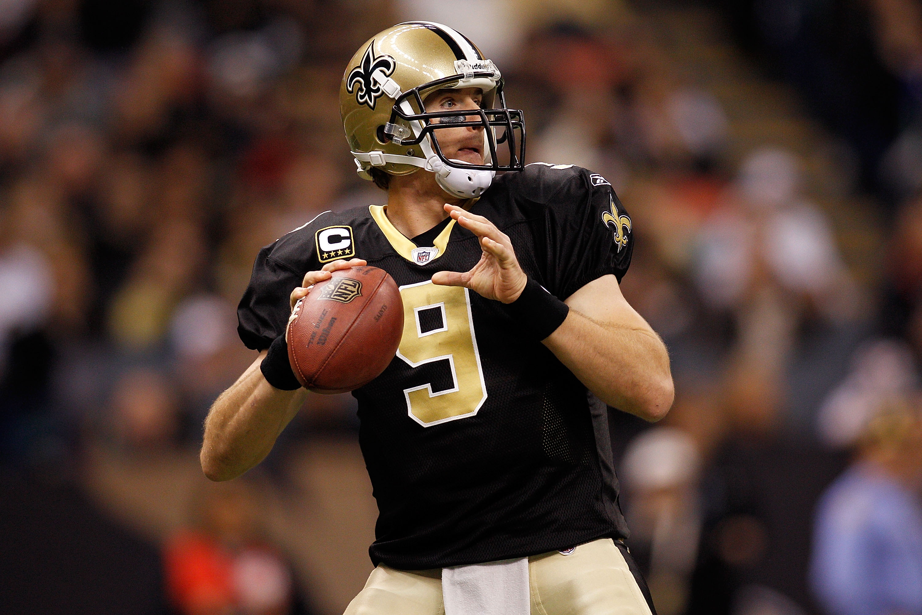 NEW ORLEANS, LA - DECEMBER 12:  Drew Brees #9  of the New Orleans Saints looks to throw the ball during the game against the St. Louis Rams at the Louisiana Superdome on December 12, 2010 in New Orleans, Louisiana.  (Photo by Chris Graythen/Getty Images)