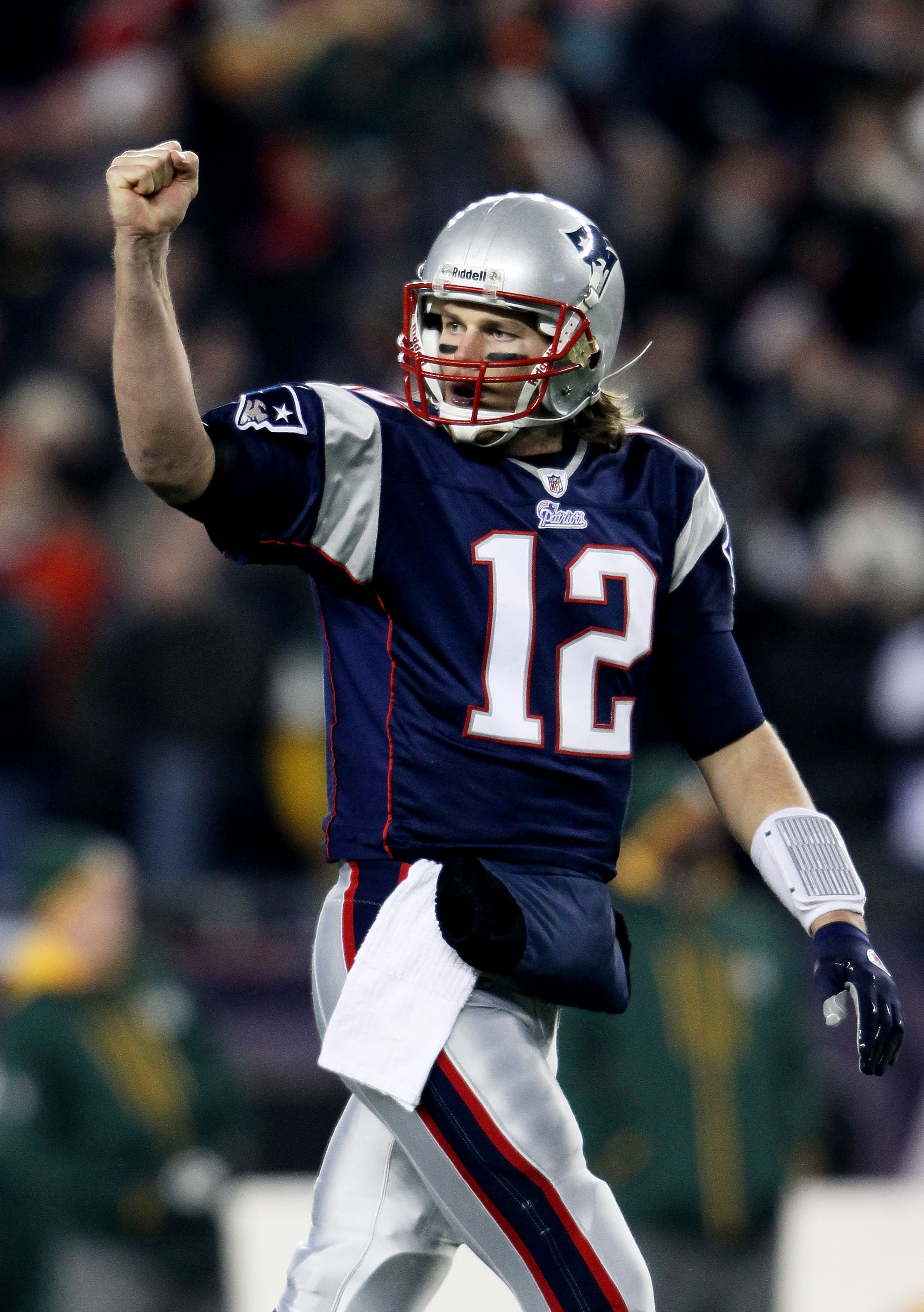FOXBORO, MA - DECEMBER 19: Quarterback Tom Brady #12 of the New England Patriots celebrates a touchdown scored by running back BenJarvus Green-Ellis #42 (not pictured) against the Green Bay Packers in the first quarter of the game at Gillette Stadium on