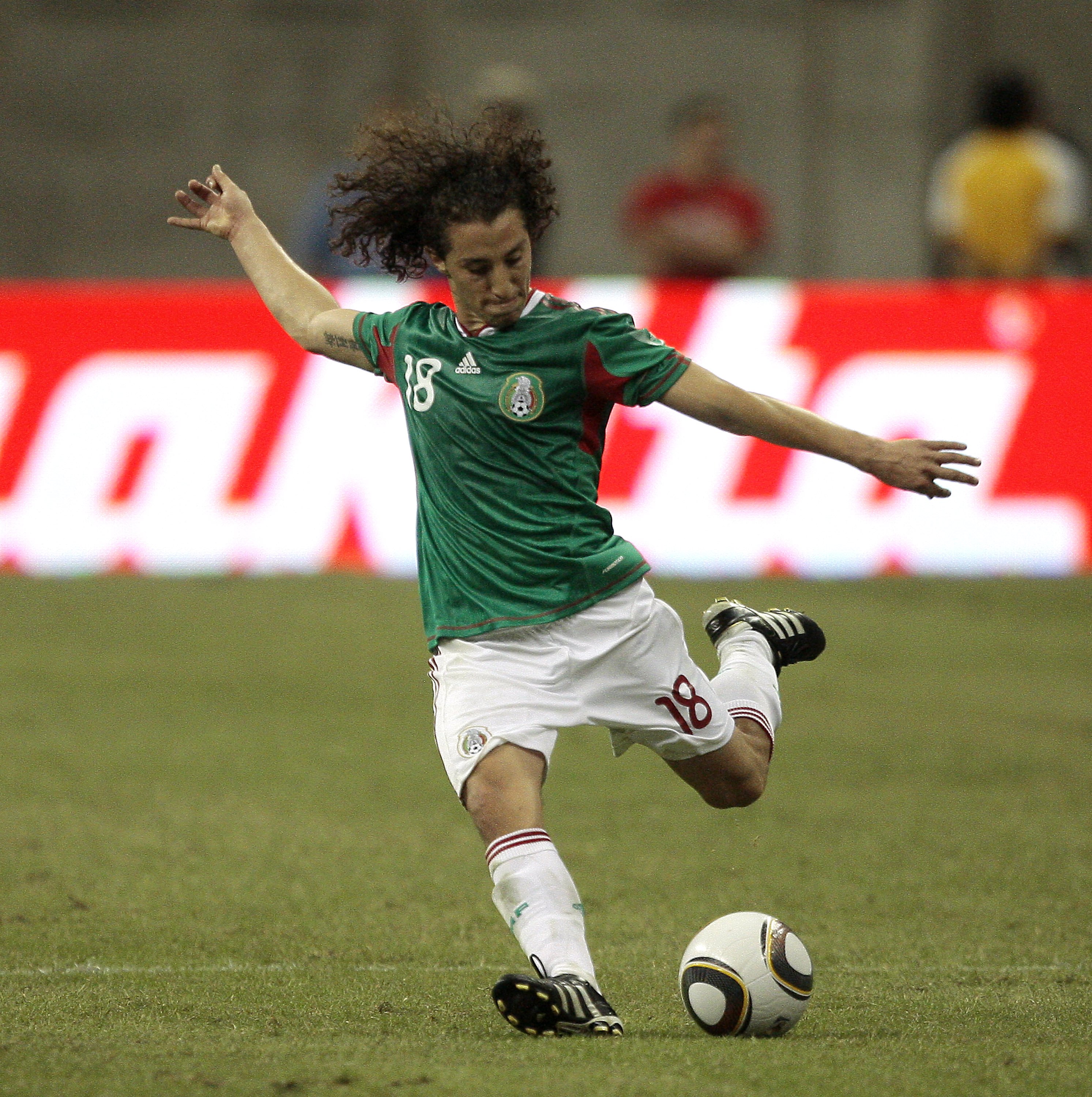 HOUSTON - MAY 13:  Andres Guardado #18 of Mexico kicks the ball against Angola at Reliant Stadium on May 13, 2010 in Houston, Texas.  (Photo by Bob Levey/Getty Images)
