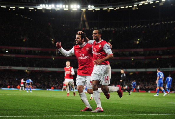 LONDON, ENGLAND - DECEMBER 27:  Cesc Fabregas of Arsenal celebrates Arsenal's second goal with Theo Walcott (R) during the Barclays Premier League match between Arsenal and Chelsea at the Emirates Stadium on December 27, 2010 in London, England.  (Photo b
