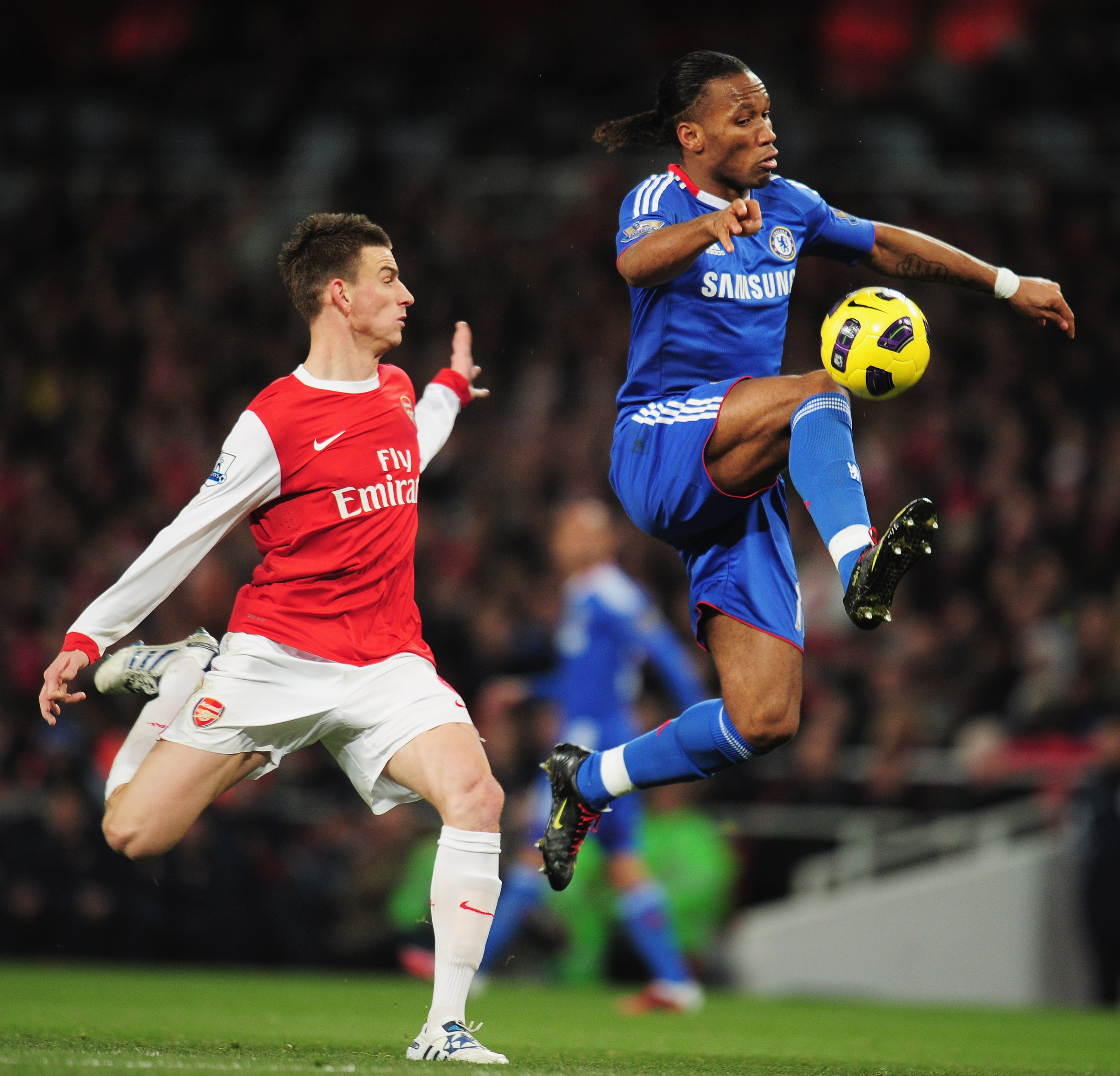 LONDON, ENGLAND - DECEMBER 27:  Didier Drogba of Chelsea controls the ball watched by Laurent Koscielny of Arsenal during the Barclays Premier League match between Arsenal and Chelsea at the Emirates Stadium on December 27, 2010 in London, England.  (Phot