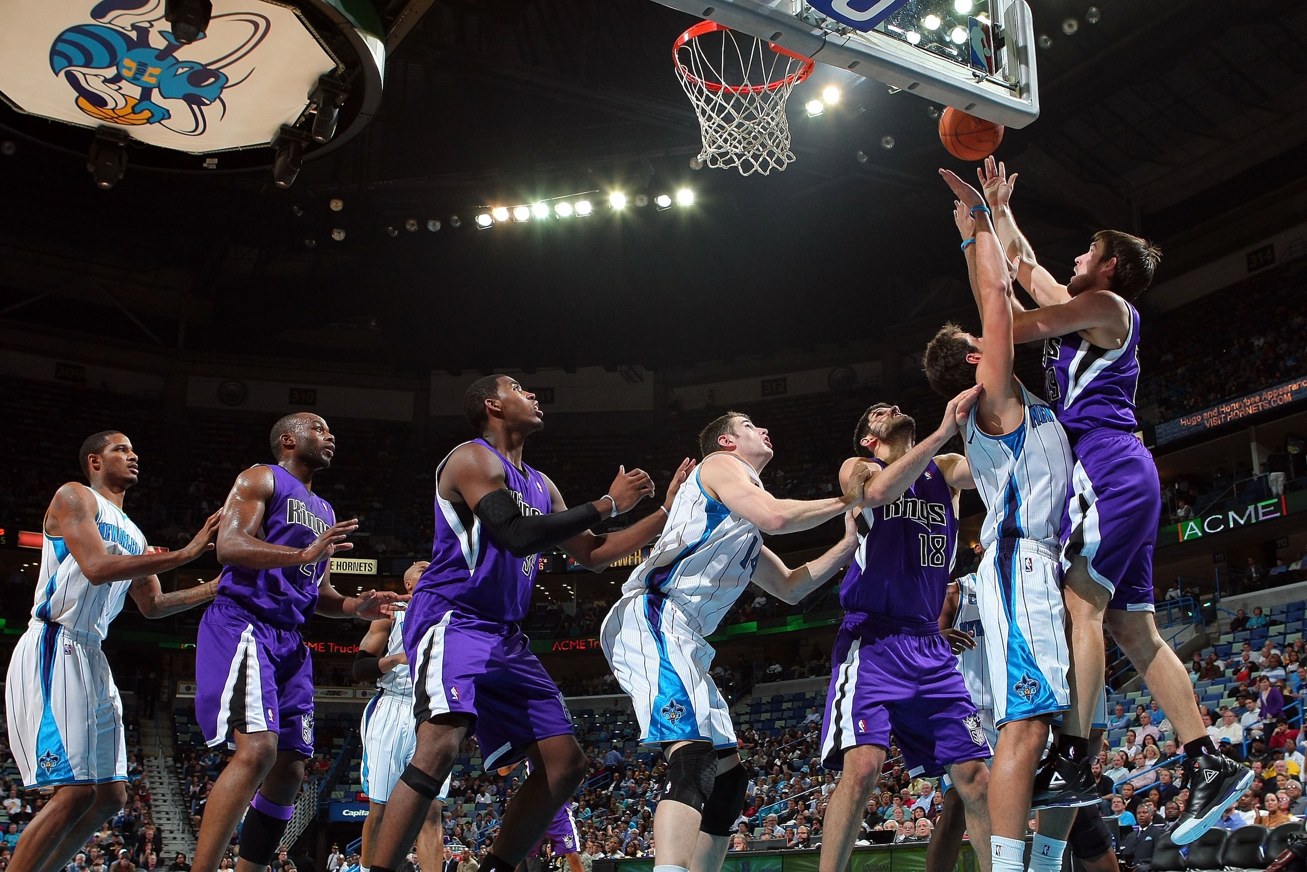 NEW ORLEANS, LA - DECEMBER 15:  Beno Udrih #19 of the Sacramento Kings shoots the ball over Marco Belinelli #8 of the New Orleans Hornets  at the New Orleans Arena on December 15, 2010 in New Orleans, Louisiana.  The Hornets defeated the Kings 94-91.  NOT