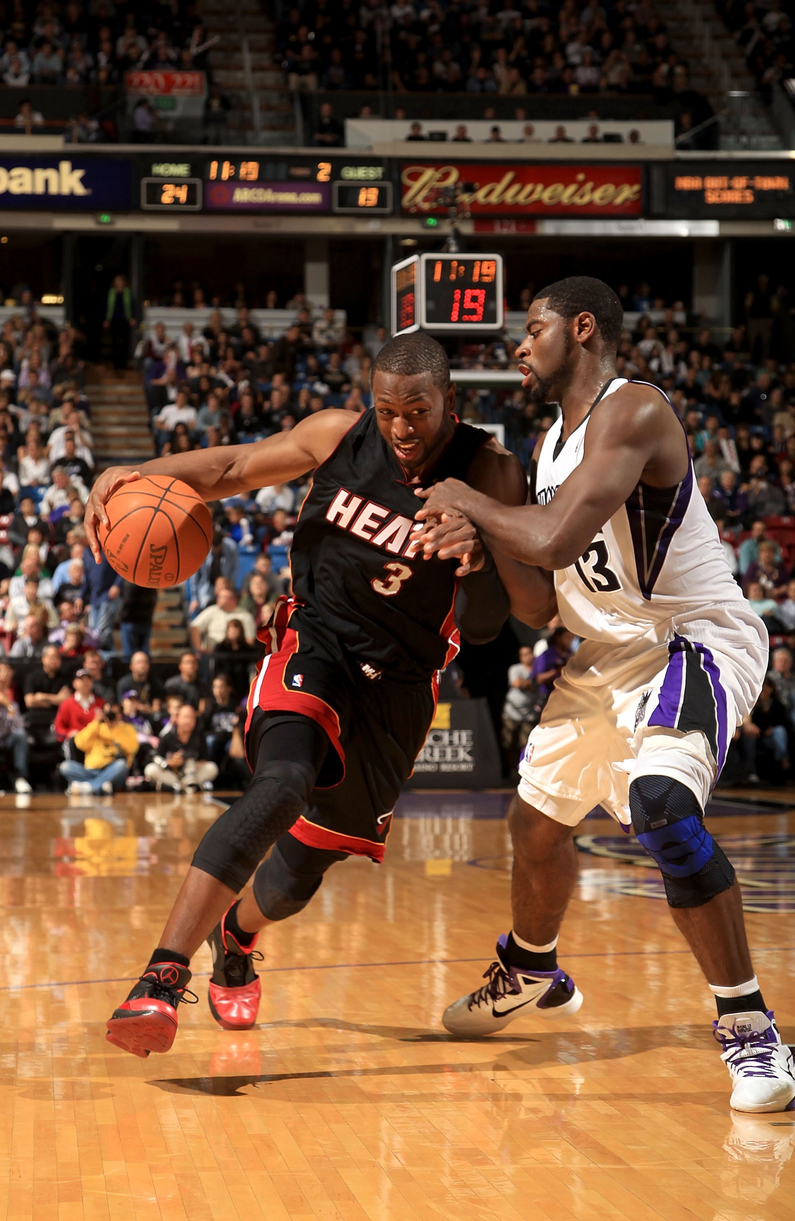 SACRAMENTO, CA - DECEMBER 11: Dwyane Wade #3 of the Miami Heat drives on Tyreke Evans #13 of the Sacramento Kings at ARCO Arena on December 11, 2010 in Sacramento, California. NOTE TO USER: User expressly acknowledges and agrees that, by downloading and o