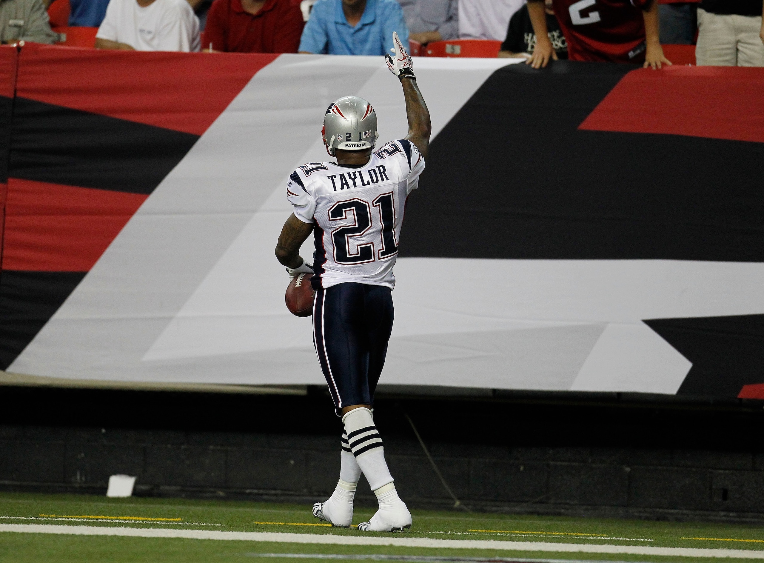ATLANTA - AUGUST 19:  Running back Fred Taylor #21 of the New England Patriots points to the crowd after his first quarter touchdown during the preseason game against the Atlanta Falcons at the Georgia Dome on August 19, 2010 in Atlanta, Georgia.  (Photo