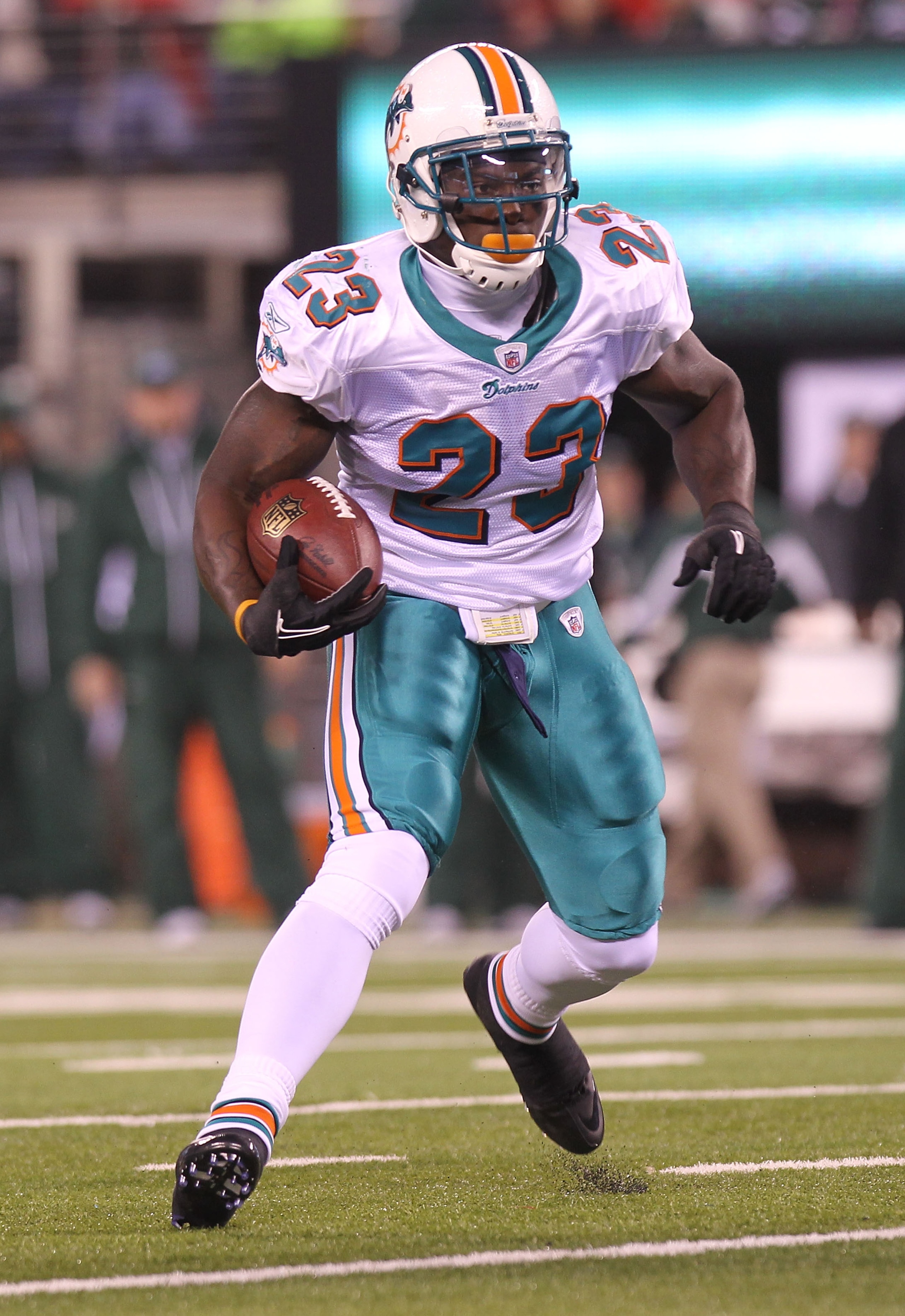 EAST RUTHERFORD, NJ - DECEMBER 12:  Ronnie Brown #23 of the Miami Dolphins rushes against the New York Jets at New Meadowlands Stadium on December 12, 2010 in East Rutherford, New Jersey.  (Photo by Nick Laham/Getty Images)