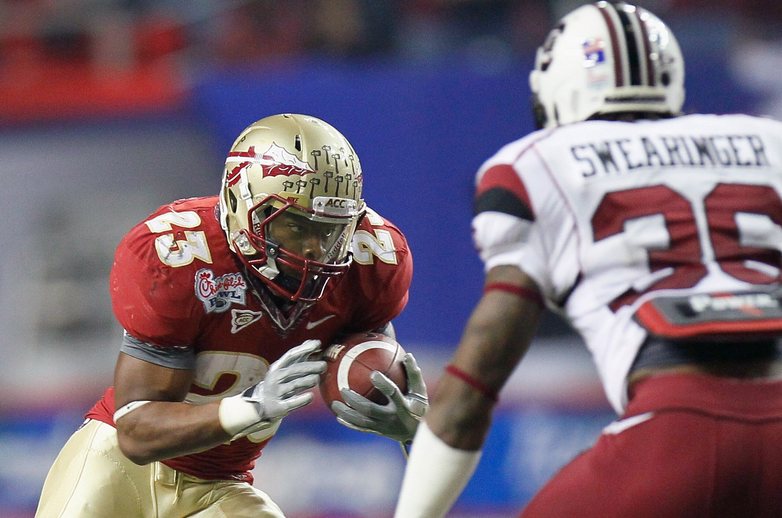 ATLANTA, GA - DECEMBER 31:  Chris Thompson #23 of the Florida State Seminoles rushes against D.J. Swearinger #36 of the South Carolina Gamecocks during the 2010 Chick-fil-A Bowl at Georgia Dome on December 31, 2010 in Atlanta, Georgia.  (Photo by Kevin C.