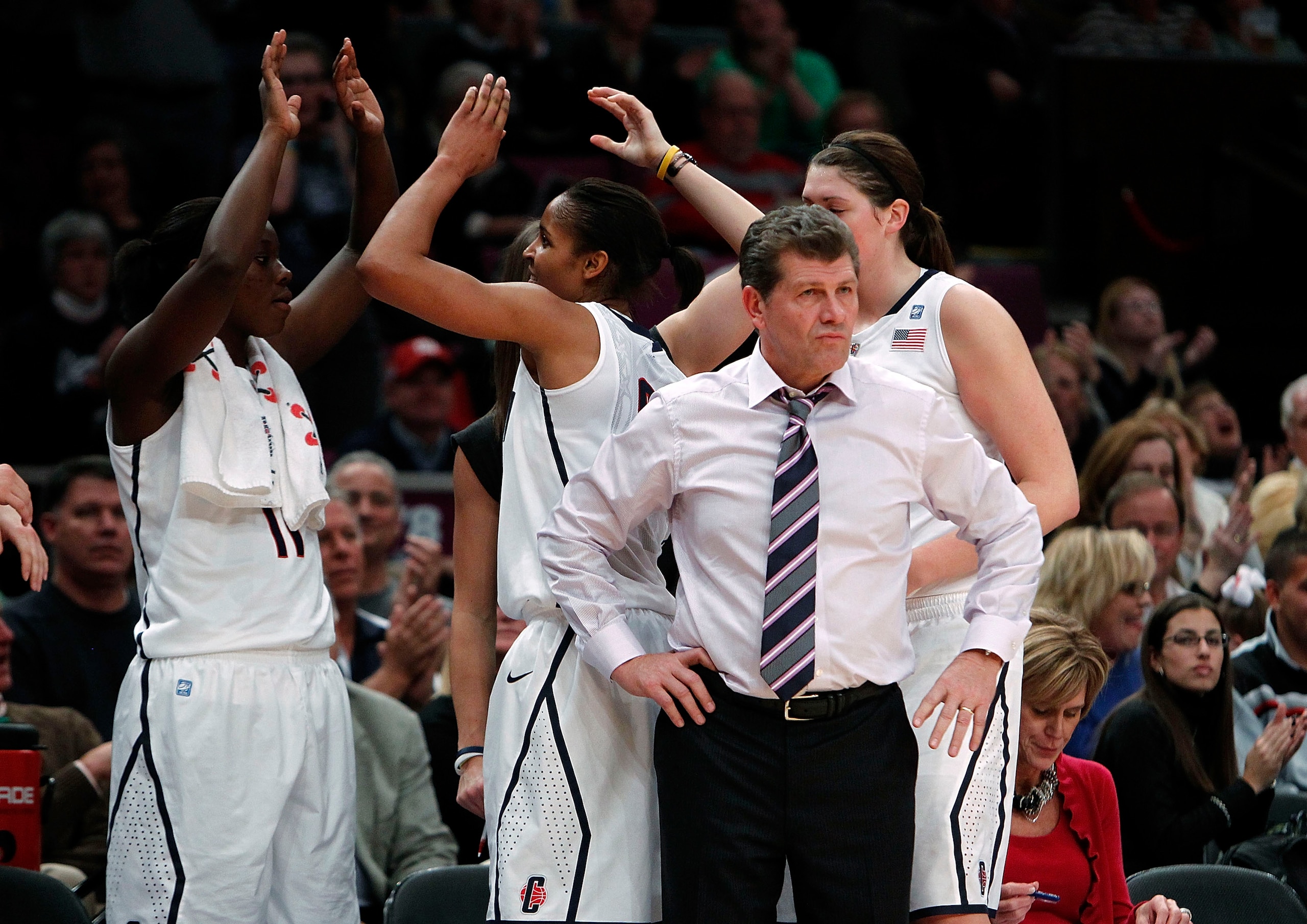 NEW YORK - DECEMBER 19:  Geno Auriemma, head coach of the Connecticut Huskies watches from the bench as players celebrate during a victory over the Ohio State Buckeyes in the Maggie Dixon Classic at Madison Square Garden on December 19, 2010 in New York C