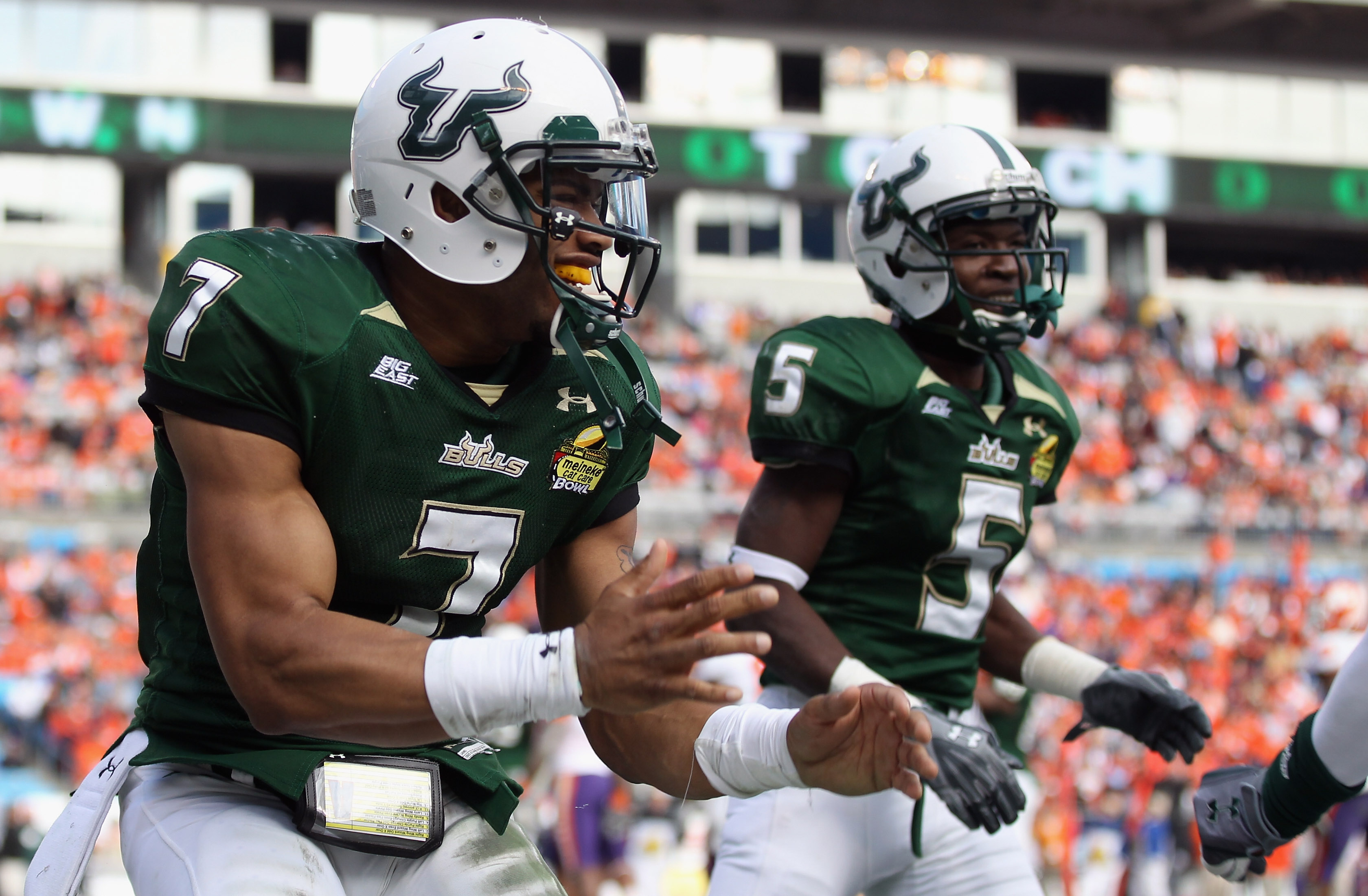 CHARLOTTE, NC - DECEMBER 31: B.J. Daniels #7 of the USF Bulls celebrates after scoring a touchdown against the Clemson Tigers during their game at Bank of America Stadium on December 31, 2010 in Charlotte, North Carolina. (Photo by Streeter Lecka/Getty