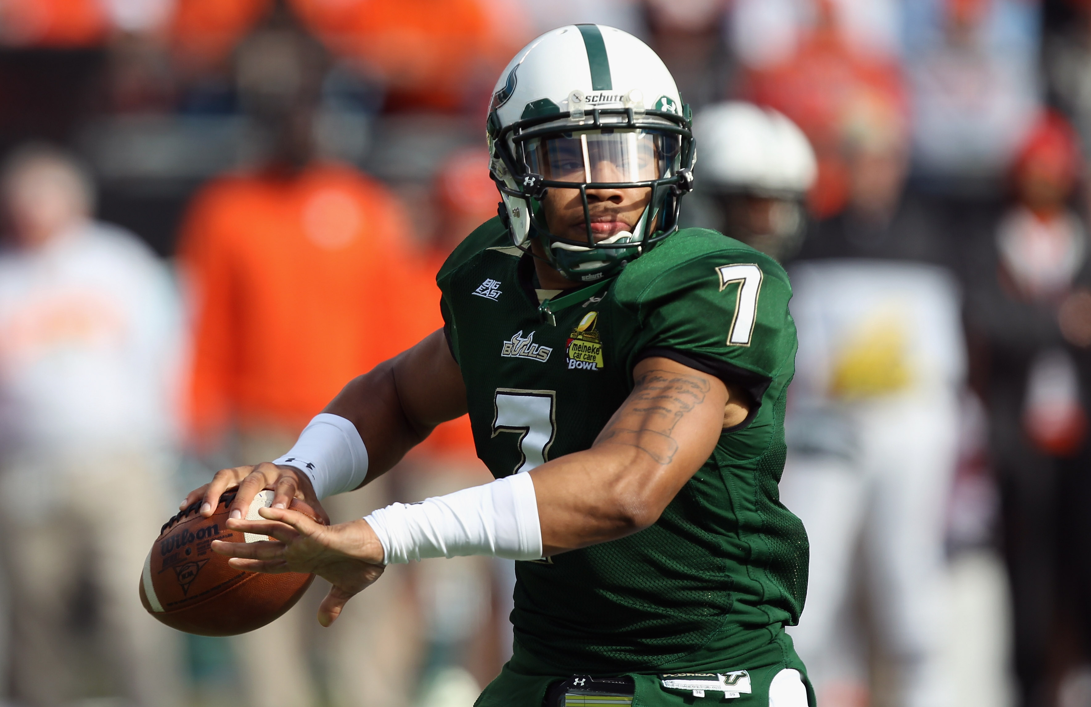 CHARLOTTE, NC - DECEMBER 31: Ryne Giddins #7 of the USF Bulls drops back to pass against the Clemson Tigers during their game at Bank of America Stadium on December 31, 2010 in Charlotte, North Carolina. (Photo by Streeter Lecka/Getty Images)