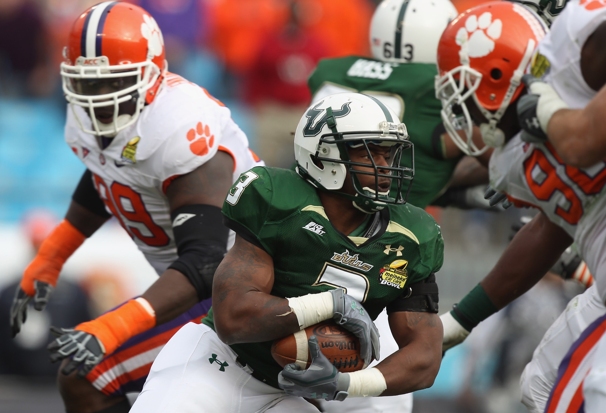 CHARLOTTE, NC - DECEMBER 31:  Moise Plancher #3 of the USF Bulls runs with the ball against the Clemson Tigers during their game at Bank of America Stadium on December 31, 2010 in Charlotte, North Carolina.  (Photo by Streeter Lecka/Getty Images)