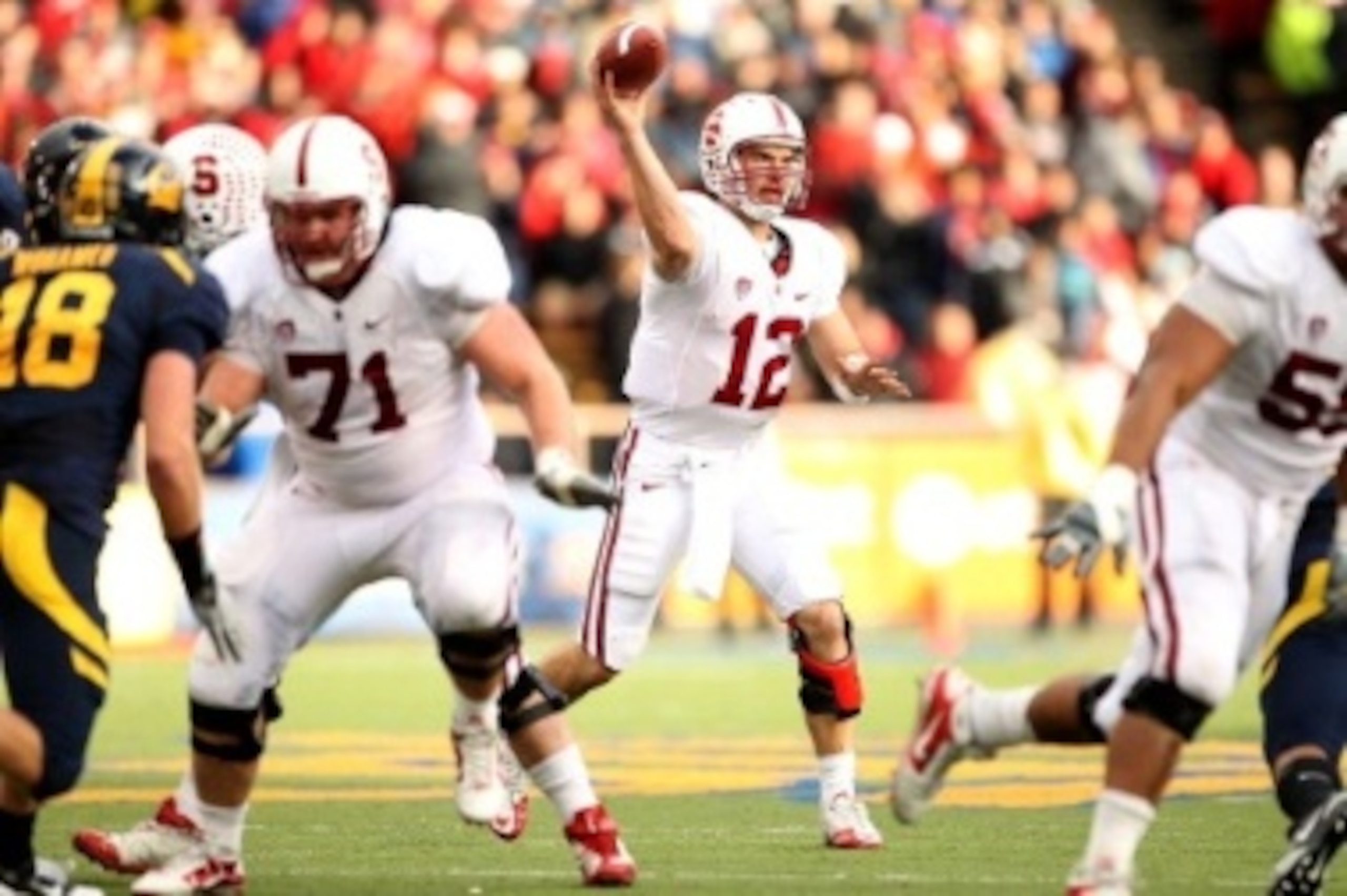 Stanford QB Andrew Luck looks to pass against Cal. Luck wound up with 235 yards passing and two scores in the blowout win at Strawberry Canyon.
