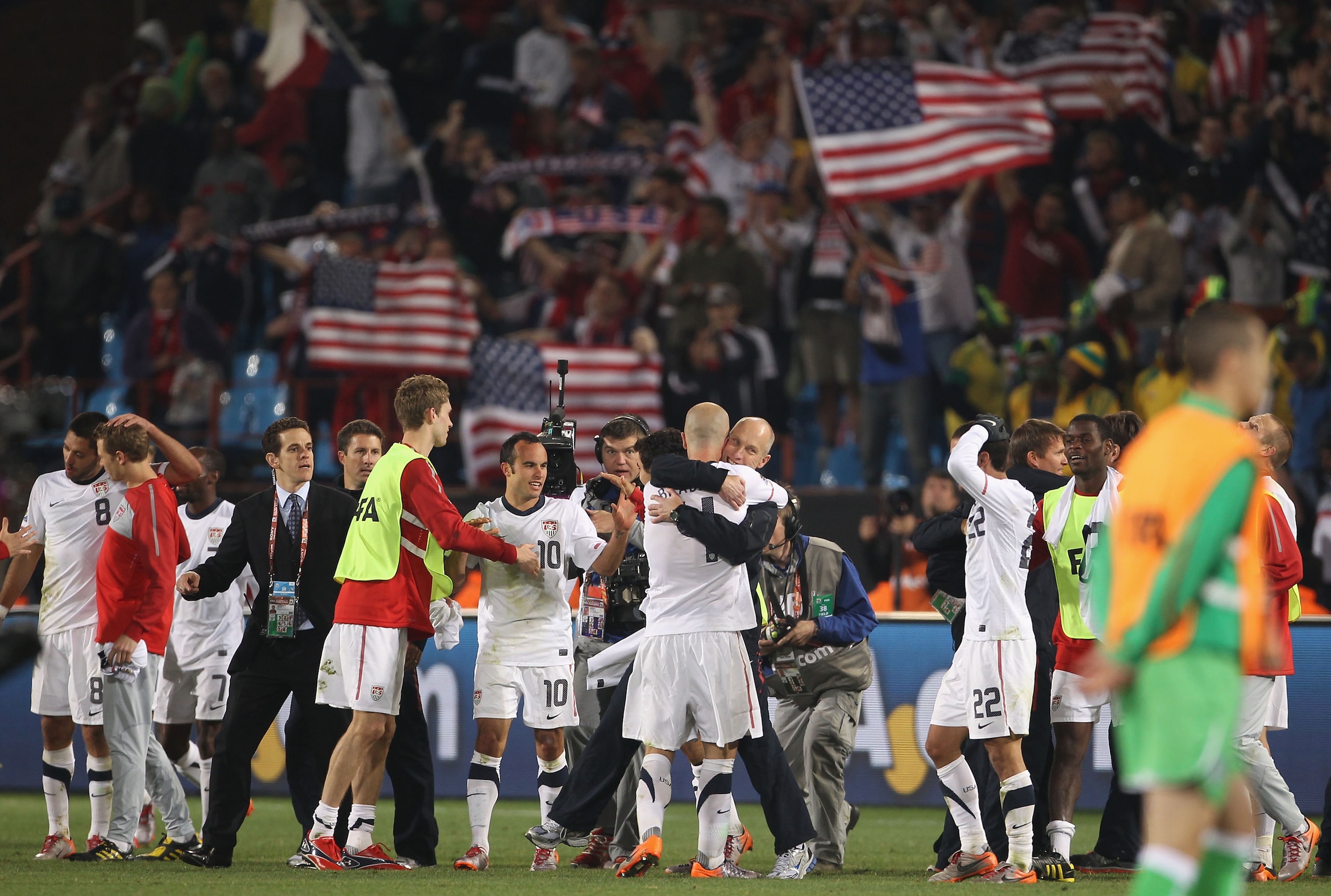 PRETORIA, SOUTH AFRICA - JUNE 23:  Bob Bradley head coach of USA hugs Michael Bradley as they celebrate the victory that sends the USA through to the second round in the 2010 FIFA World Cup South Africa Group C match between USA and Algeria at the Loftus 