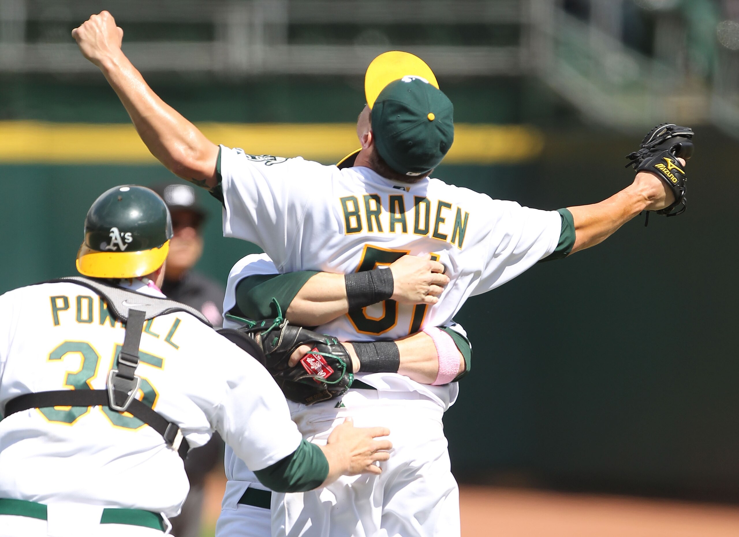 OAKLAND, CA - MAY 09:  Dallas Braden #51 of the Oakland Athletics celebrates after pitching a perfect game against the Tampa Bay Rays during an MLB game at the Oakland-Alameda County Coliseum on May 9, 2010 in Oakland, California.  (Photo by Jed Jacobsohn