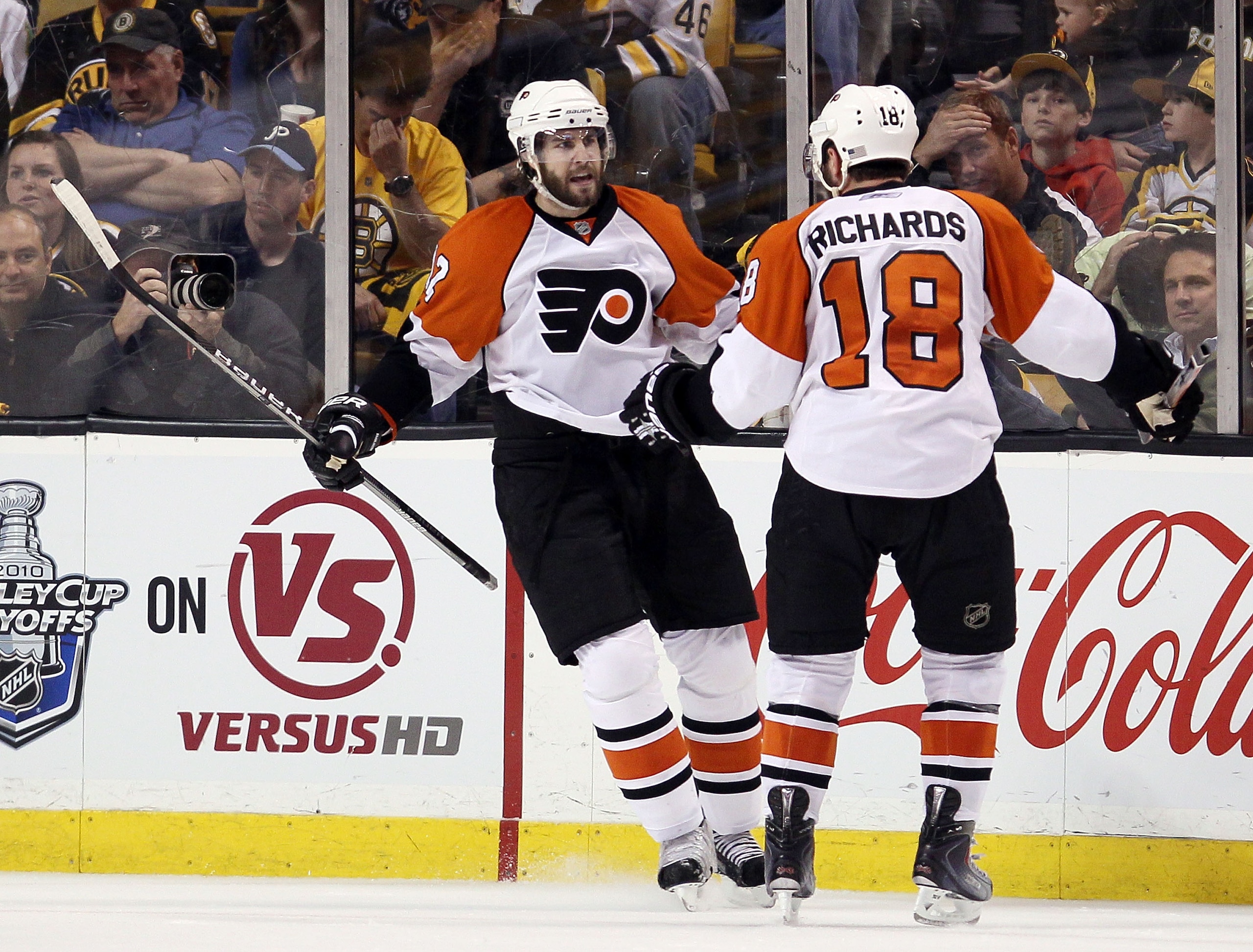 BOSTON - MAY 14:  Simon Gagne #12 of the Philadelphia Flyers is congratulated by teammate Mike Richards #18 after Gagne scored the game winner on a power play in the third period against the Boston Bruins in Game Seven of the Eastern Conference Semifinals
