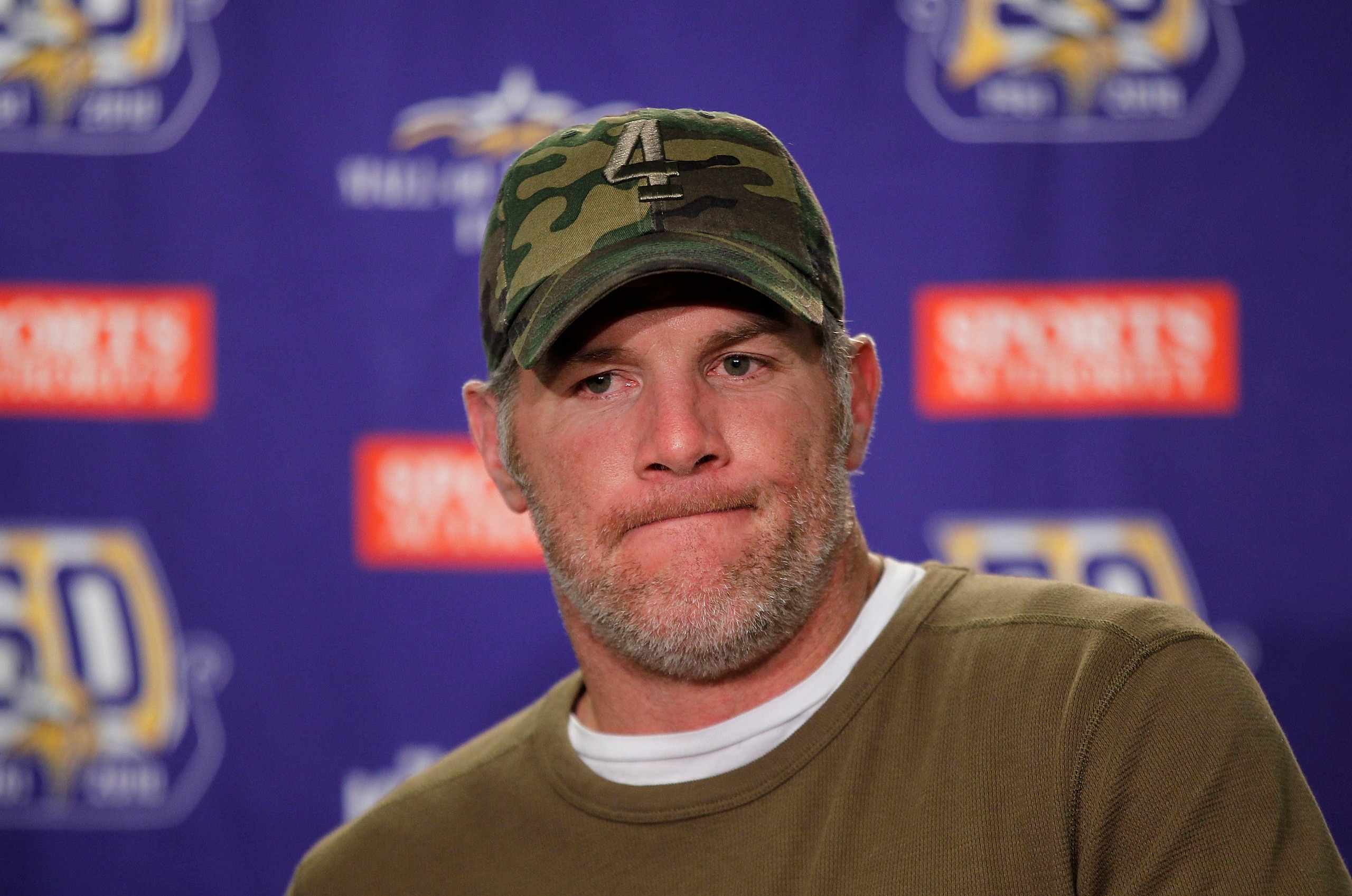 DETROIT, MI - DECEMBER 13:  Brett Favre #4 of the Minnesota Vikings talks to the media after the game against the New York Giants at Ford Field on December 13, 2010 in Detroit, Michigan. The Giants defeated the Vikings 21-3.  (Photo by Leon Halip/Getty Im