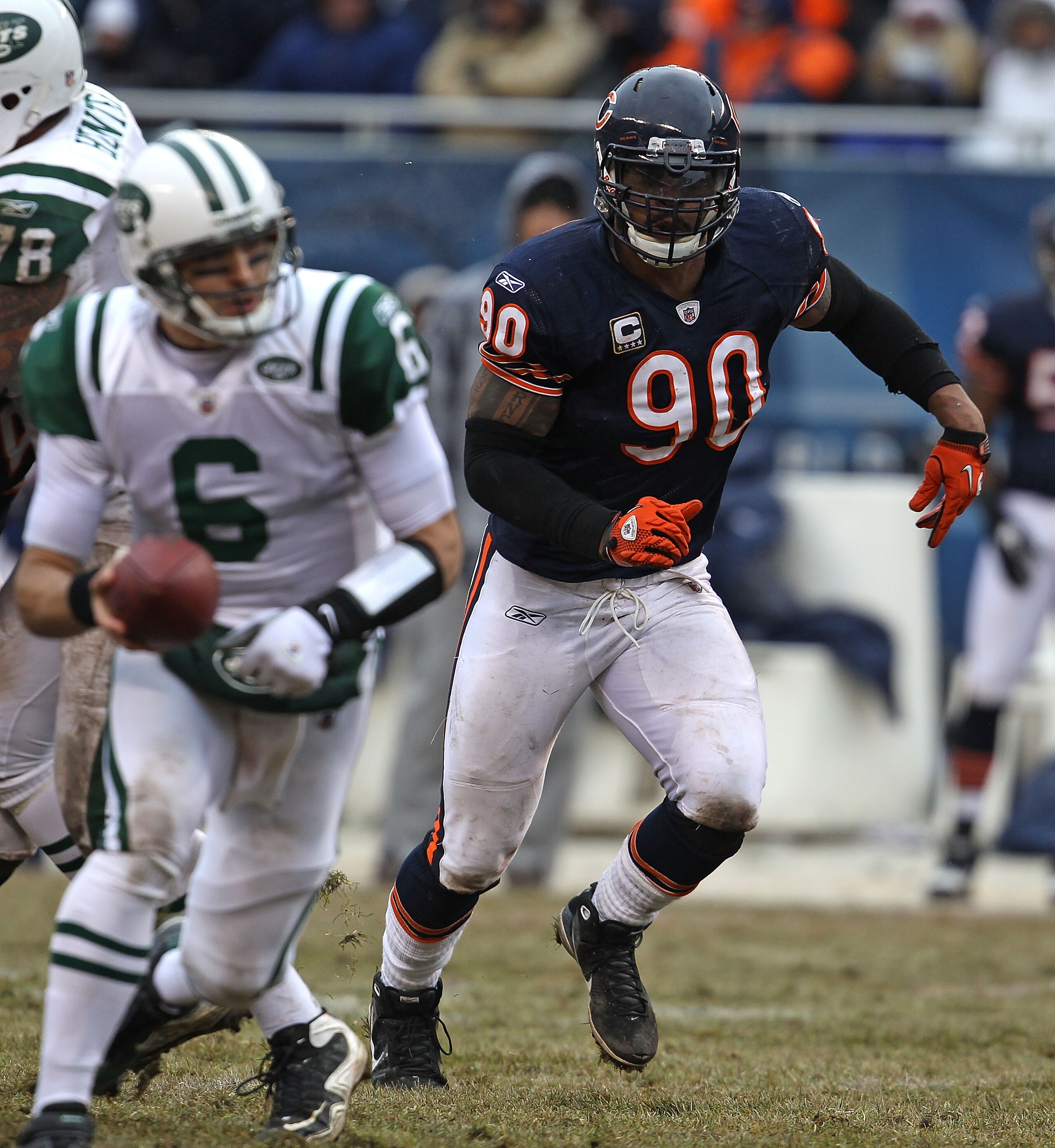 CHICAGO, IL - DECEMBER 26: Julius Peppers #90 of the Chicago Bears rushes against Mark Sanchez #6 of the New York Jets at Soldier Field on December 26, 2010 in Chicago, Illinois. The Bears defeated the Jets 38-34. (Photo by Jonathan Daniel/Getty Images)