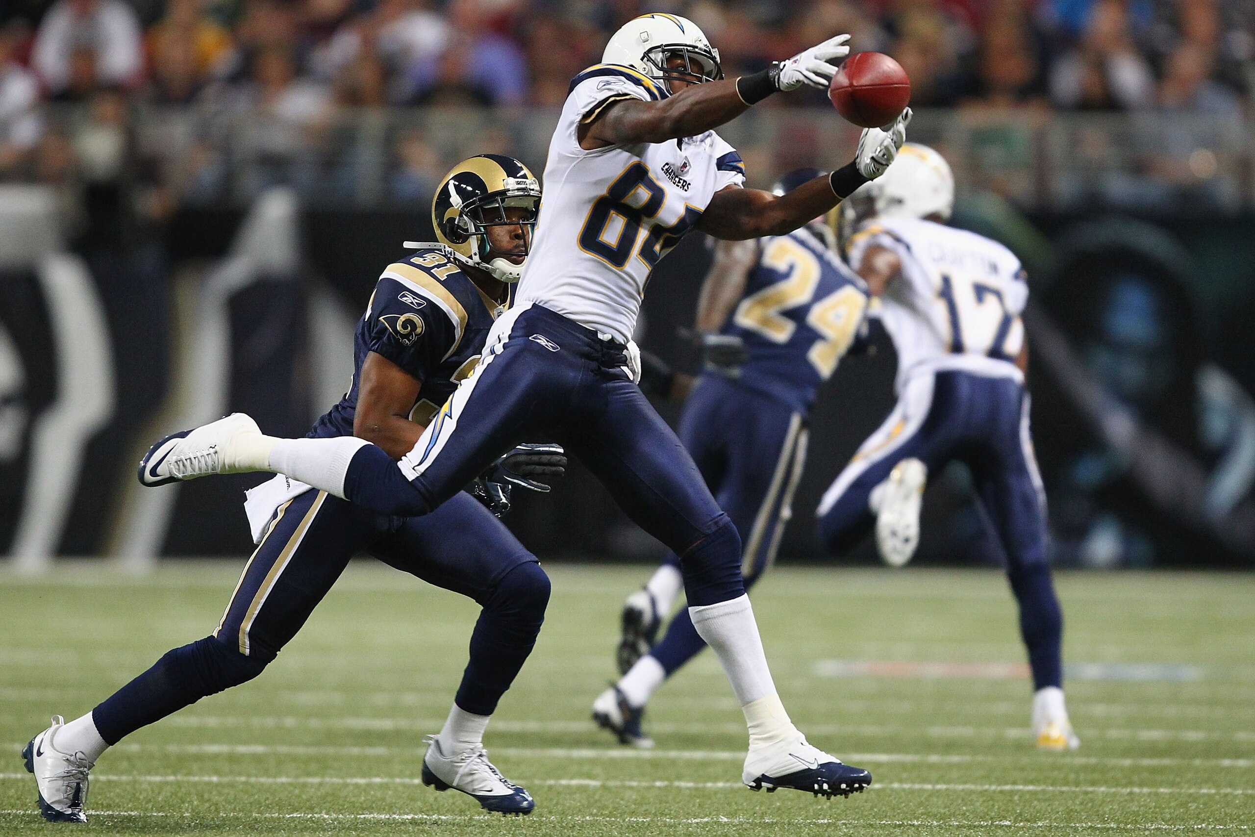 ST. LOUIS - OCTOBER 17: Buster Davis #84 of the San Diego Chargers attemptes to haul in a pass against Justin King #31 of the St. Louis Rams at the Edward Jones Dome on October 17, 2010 in St. Louis, Missouri.  The Rams beat the Chargers 20-17.  (Photo by