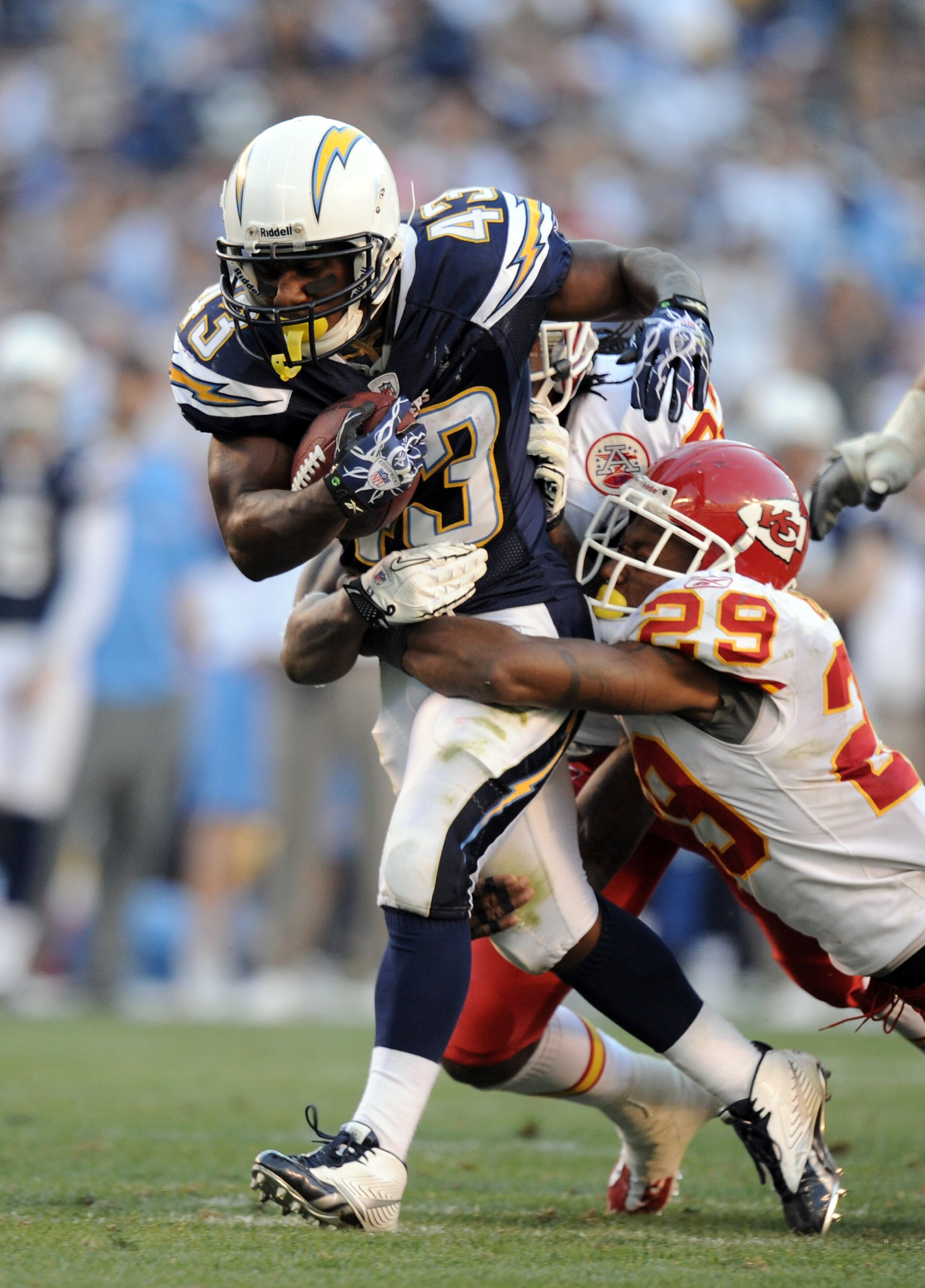 SAN DIEGO, CA - DECEMBER 12:  Darren Sproles #43 of the San Diego Chargers drags Eric Berry #29 of the Kansas City Chiefs on his run at Qualcomm Stadium on December 12, 2010 in San Diego, California.  (Photo by Harry How/Getty Images)
