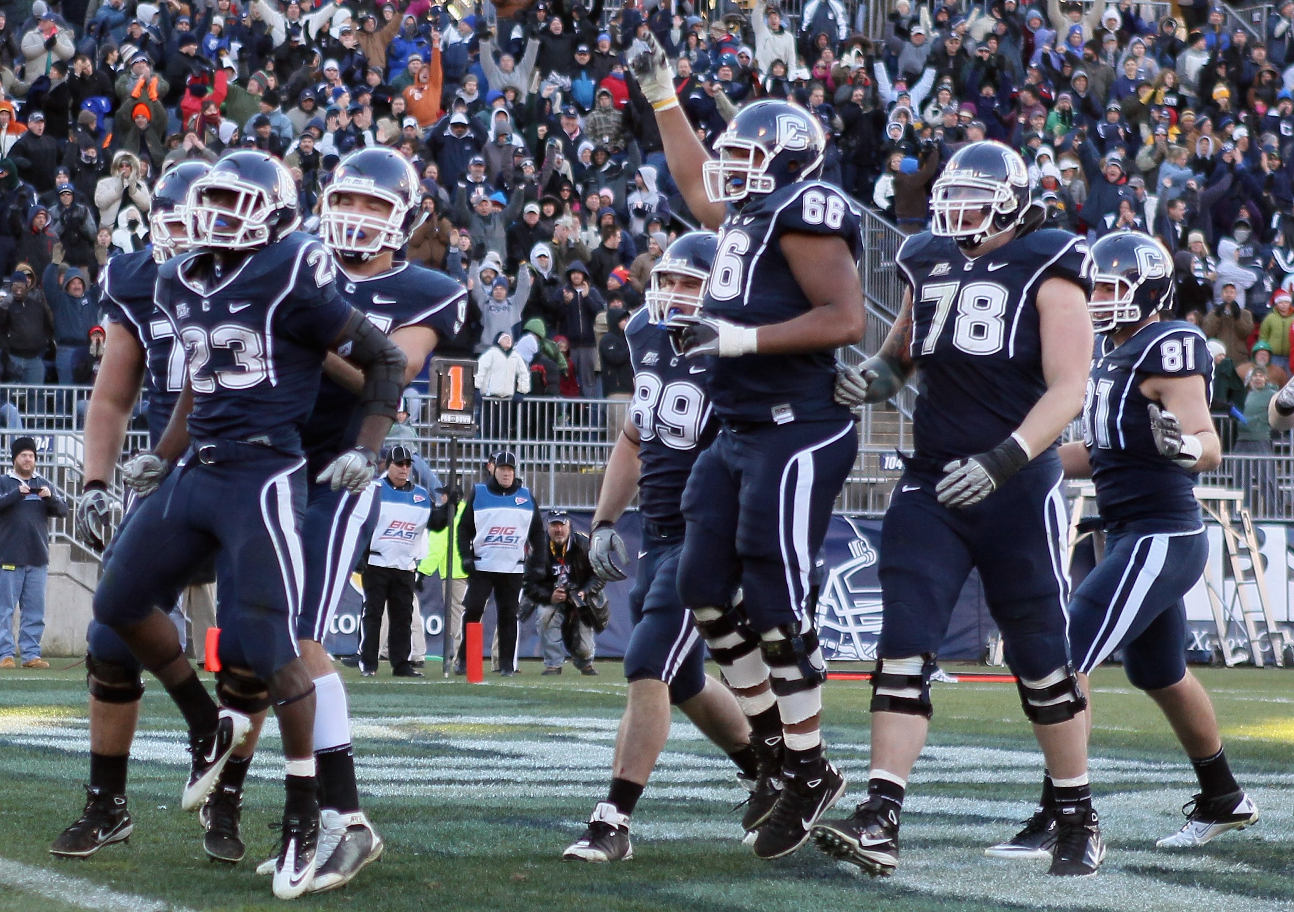 EAST HARTFORD, CT - NOVEMBER 27: Jordan Todman #23 of the Connecticut Huskies celebrates his touchdown with teammates Ryan Griffin #94, Kevin Friend #77 and Mathieu Olivier #66 in the fourth quarter against the Cincinnati Bearcats on November 27, 2010 at EAST HARTFORD, CT - NOVEMBER 27: Jordan Todman #23 of the Connecticut Huskies celebrates his touchdown with teammates Ryan Griffin #94, Kevin Friend #77 and Mathieu Olivier #66 in the fourth quarter against the Cincinnati Bearcats on November 27, 2010 at