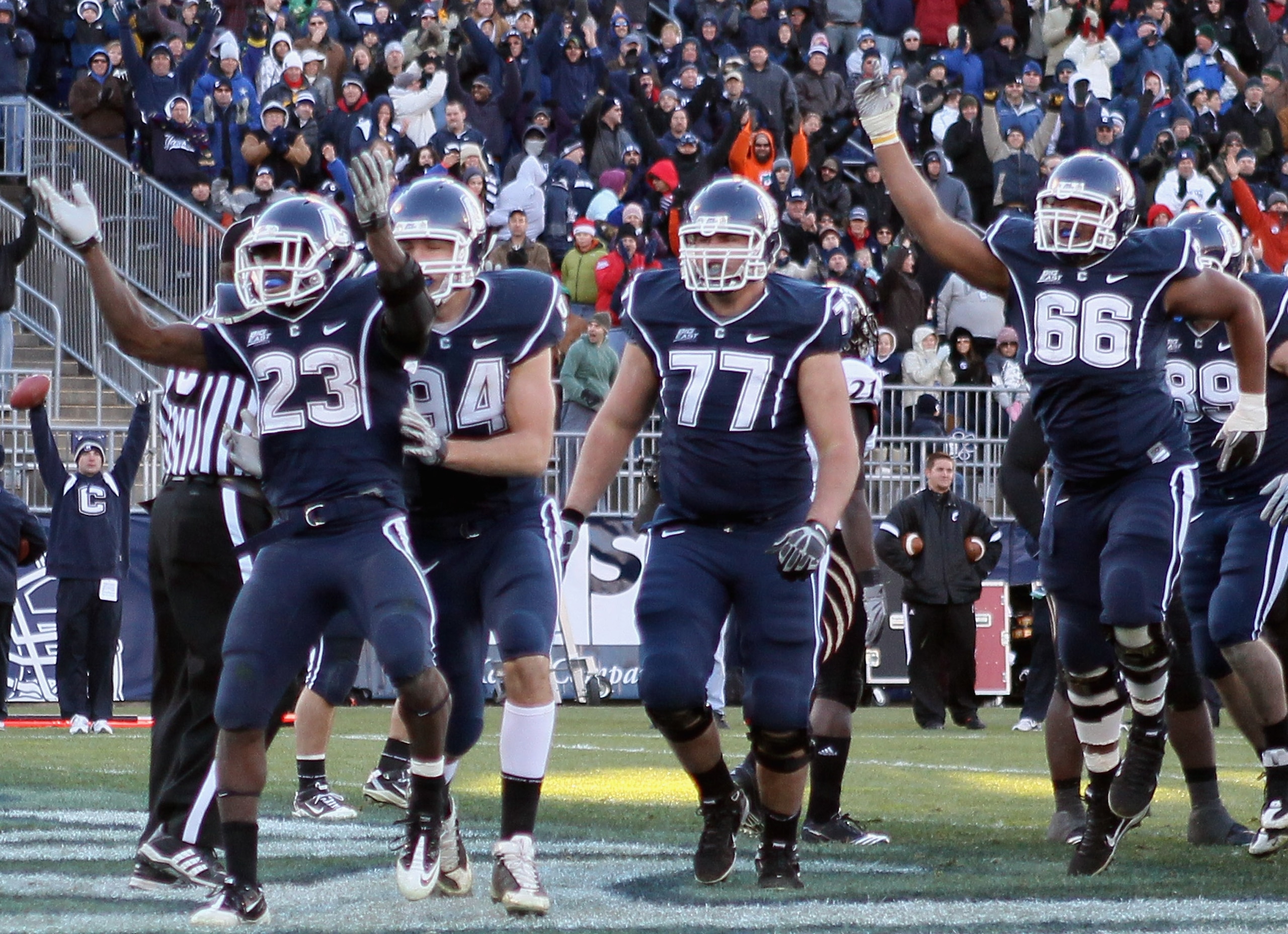 EAST HARTFORD, CT - NOVEMBER 27: Jordan Todman #23 of the Connecticut Huskies celebrates his touchdown with teammates Ryan Griffin #94, Kevin Friend #77 and Mathieu Olivier #66 in the fourth quarter against the Cincinnati Bearcats on November 27, 2010 at EAST HARTFORD, CT - NOVEMBER 27: Jordan Todman #23 of the Connecticut Huskies celebrates his touchdown with teammates Ryan Griffin #94, Kevin Friend #77 and Mathieu Olivier #66 in the fourth quarter against the Cincinnati Bearcats on November 27, 2010 at