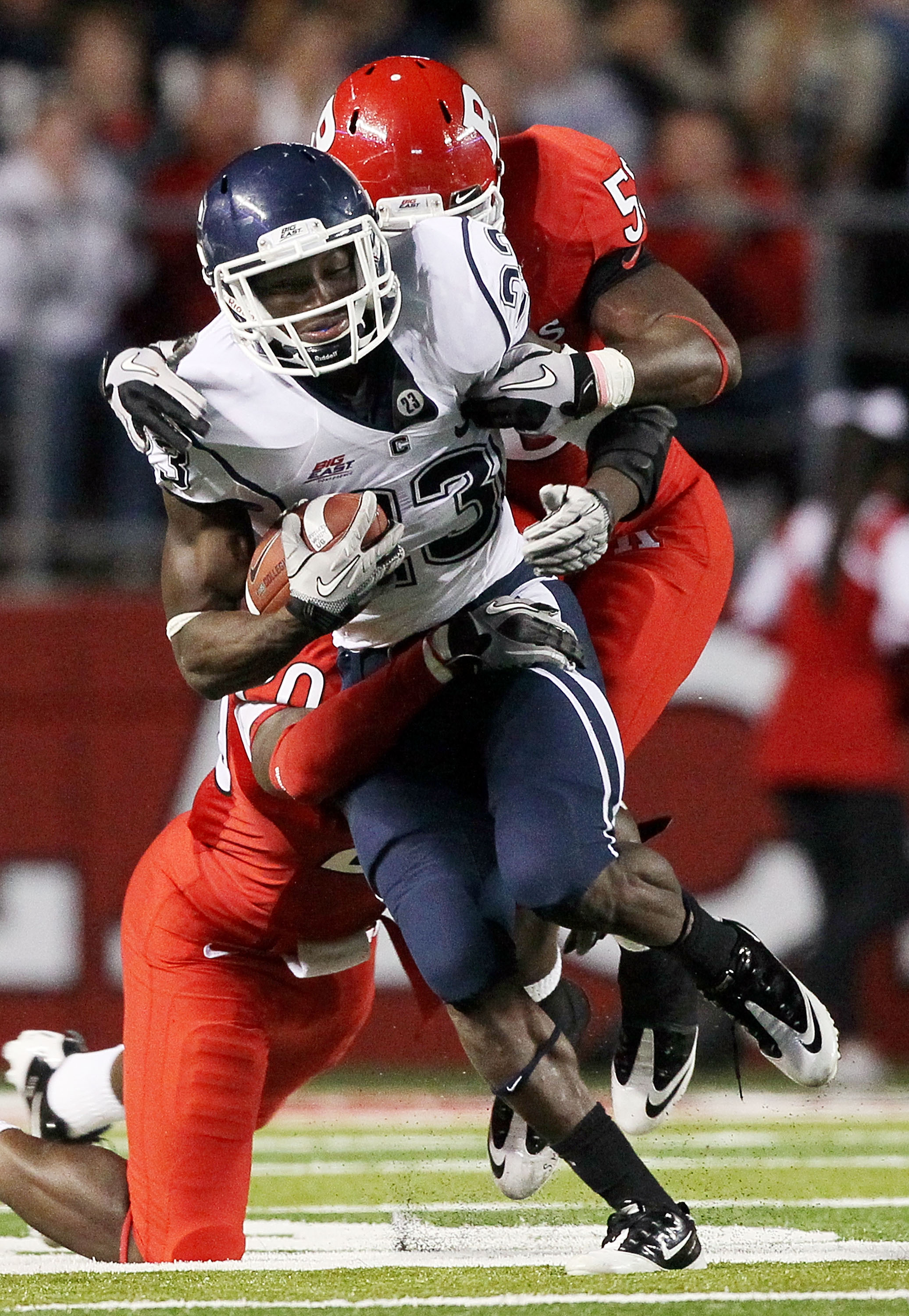 PISCATAWAY, NJ - OCTOBER 08: Jordan Todman #23 of the Connecticut Huskies runs the ball against the Rutgers Scarlet Knights at Rutgers Stadium on October 8, 2010 in Piscataway, New Jersey. Rutgers defeated UConn 27-24. (Photo by Jim McIsaac/Getty Images