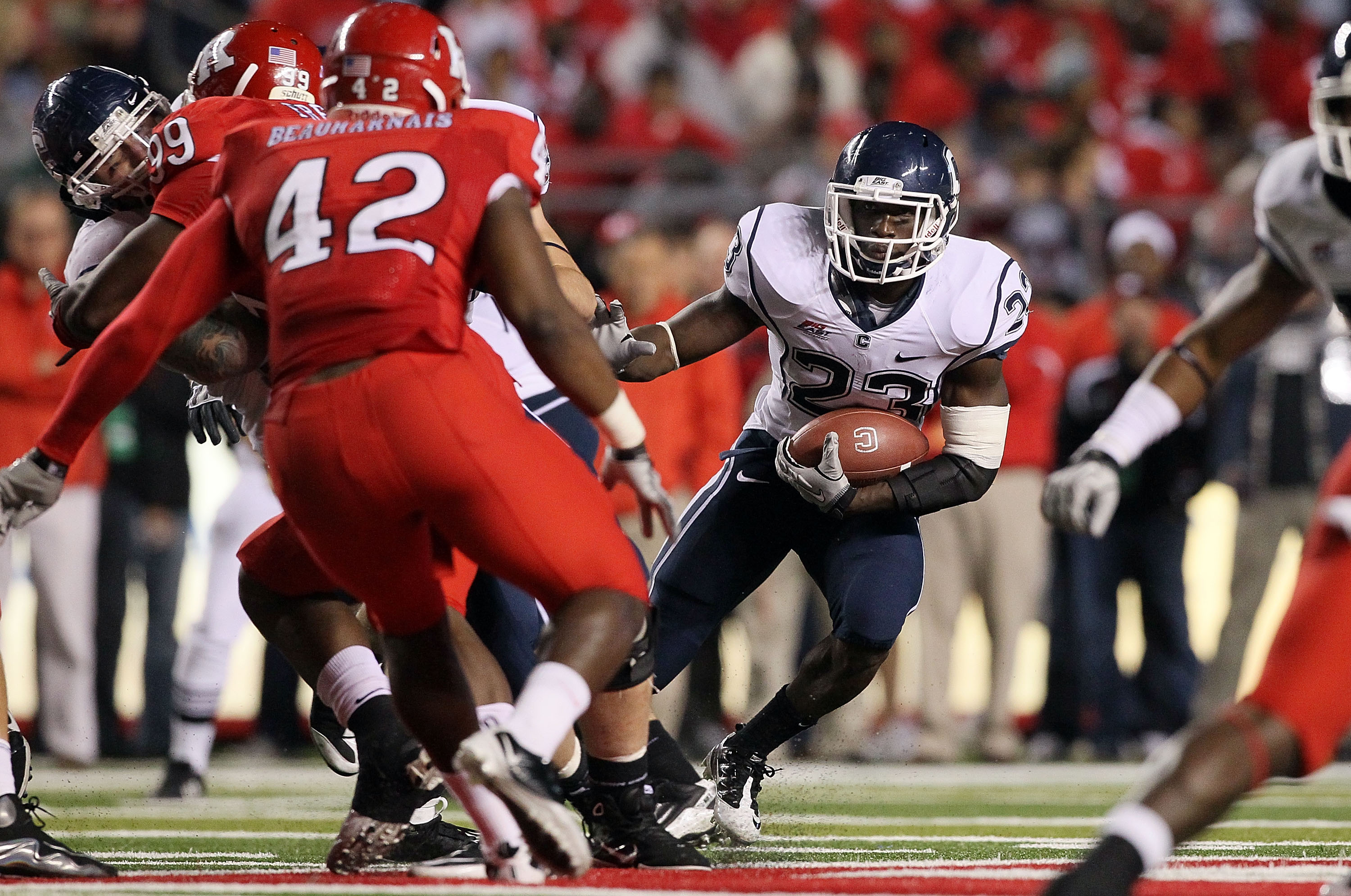PISCATAWAY, NJ - OCTOBER 08: Jordan Todman #23 of the Connecticut Huskies runs the ball against the Rutgers Scarlet Knights at Rutgers Stadium on October 8, 2010 in Piscataway, New Jersey. Rutgers defeated UConn 27-24. (Photo by Jim McIsaac/Getty Images