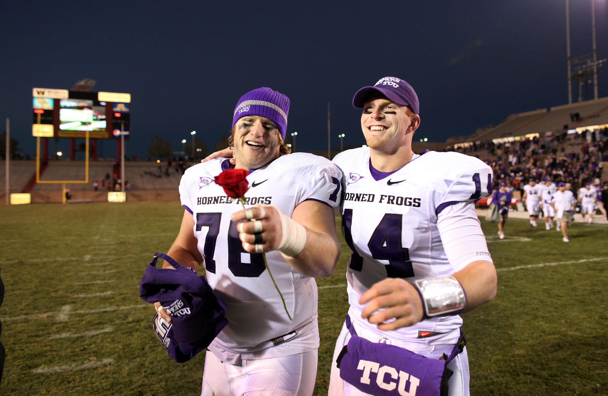 ALBUQUERQUE, NM - NOVEMBER 27: Jake Kirkpatrick #76 and Andy Dalton #14 of the TCU Horned Frogs celebrate the win against the University of New Mexico Lobos on November 27, 2010 at University Stadium in Albuquerque, New Mexico. TCU won 66-17. (Photo by Er