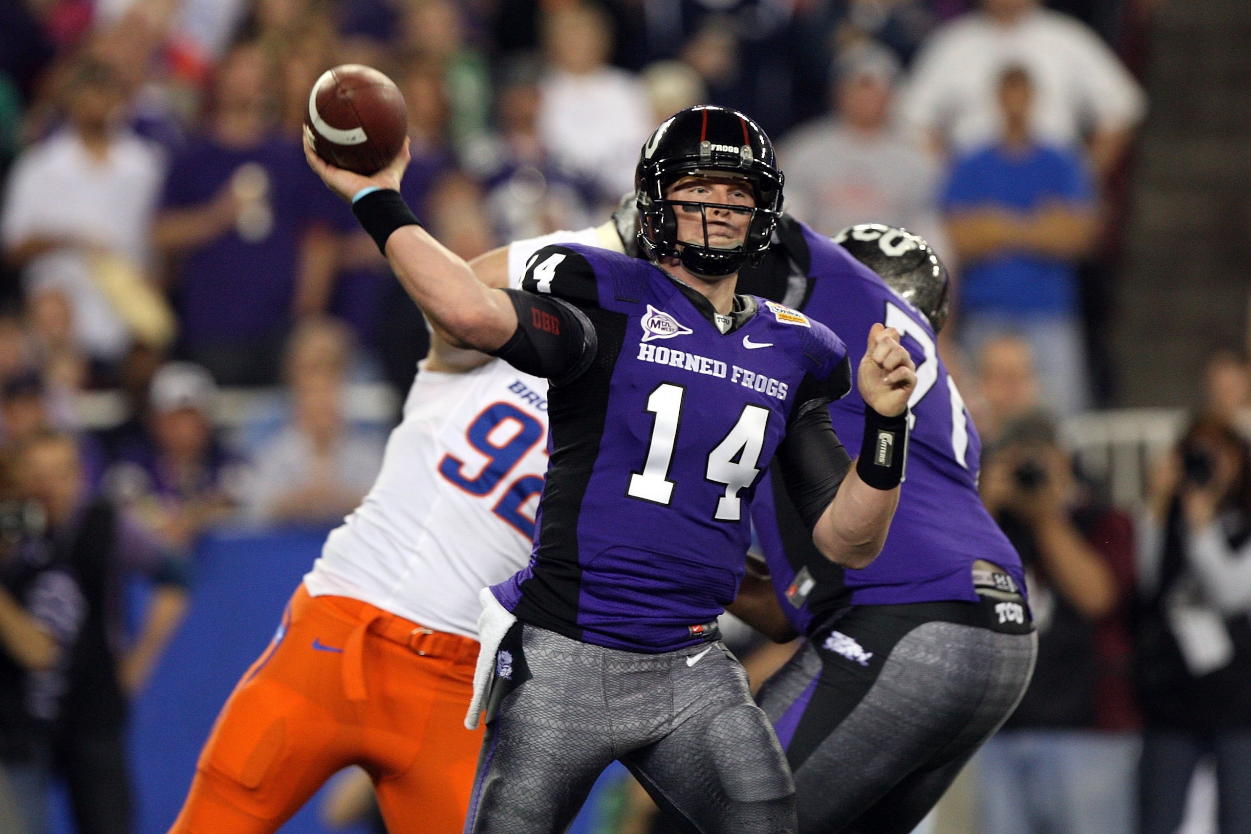 GLENDALE, AZ - JANUARY 04:  Quarterback Andy Dalton #14 of the TCU Horned Frogs passes the ball against the Boise State Broncos during the Tostitos Fiesta Bowl at the Universtity of Phoenix Stadium on January 4, 2010 in Glendale, Arizona.  (Photo by Jed J