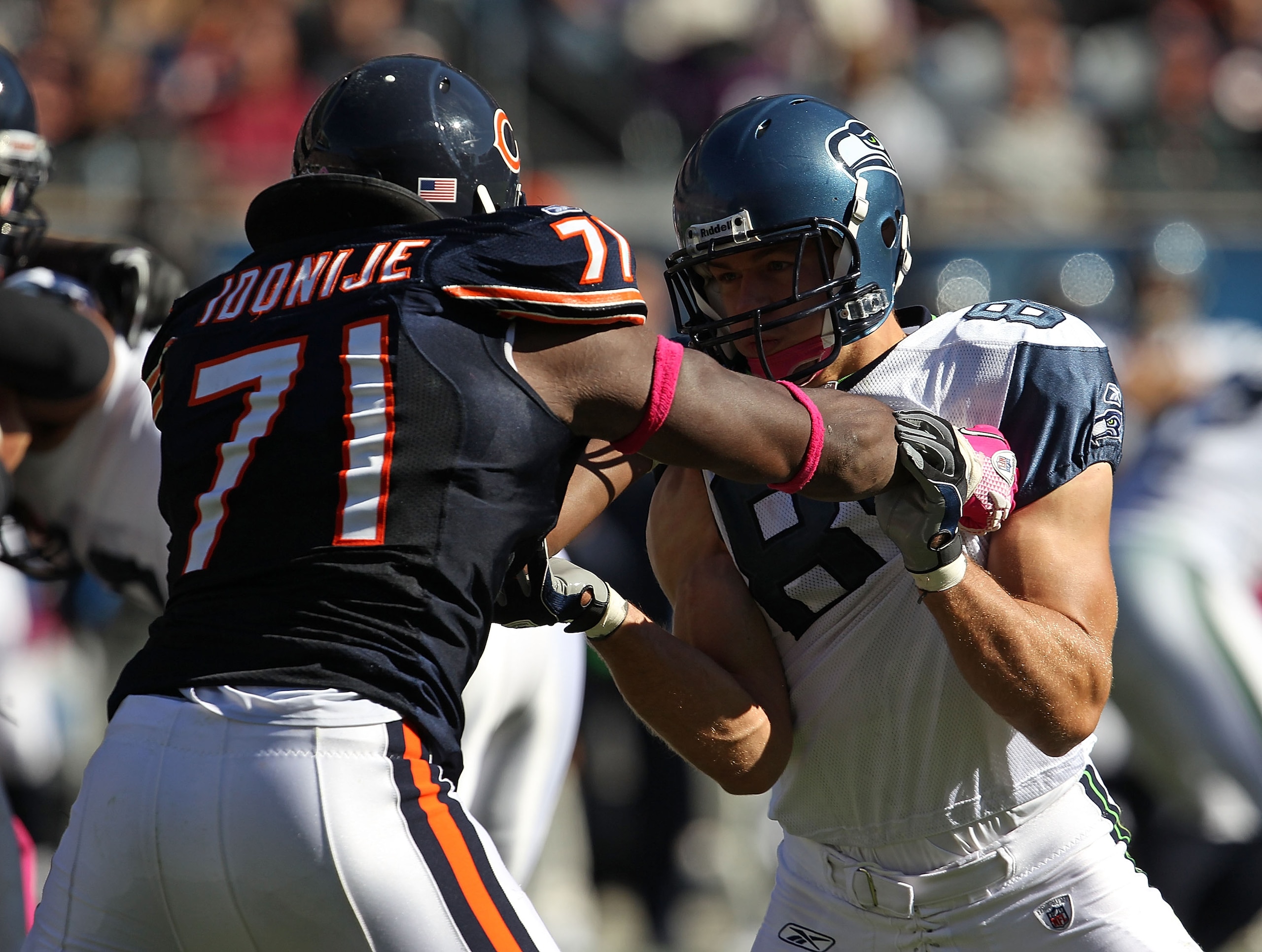 CHICAGO - OCTOBER 17: John Carlson #89 of the Seattle Seahawks blocks Israel Idonije #71 of the Chicago Bears at Soldier Field on October 17, 2010 in Chicago, Illinois. The Seahawks defeated the Bears 23-20. (Photo by Jonathan Daniel/Getty Images)