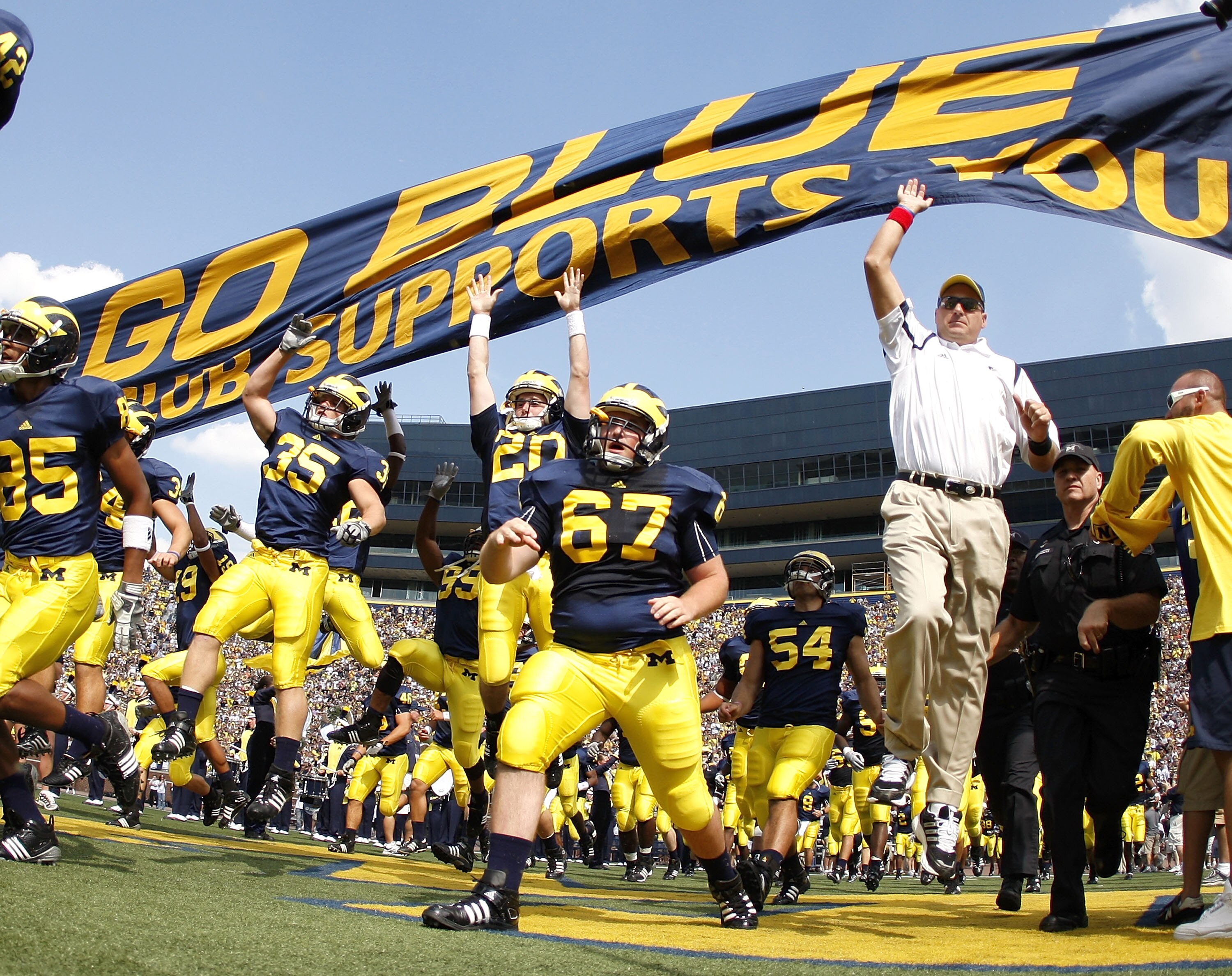 ANN ARBOR, MI - SEPTEMBER 05:  Head coach Rich Rodriguez enters the stadium with his team prior to playing the Western Michigan Broncos on September 5, 2009 at Michigan Stadium in Ann Arbor, Michigan.  (Photo by Gregory Shamus/Getty Images)