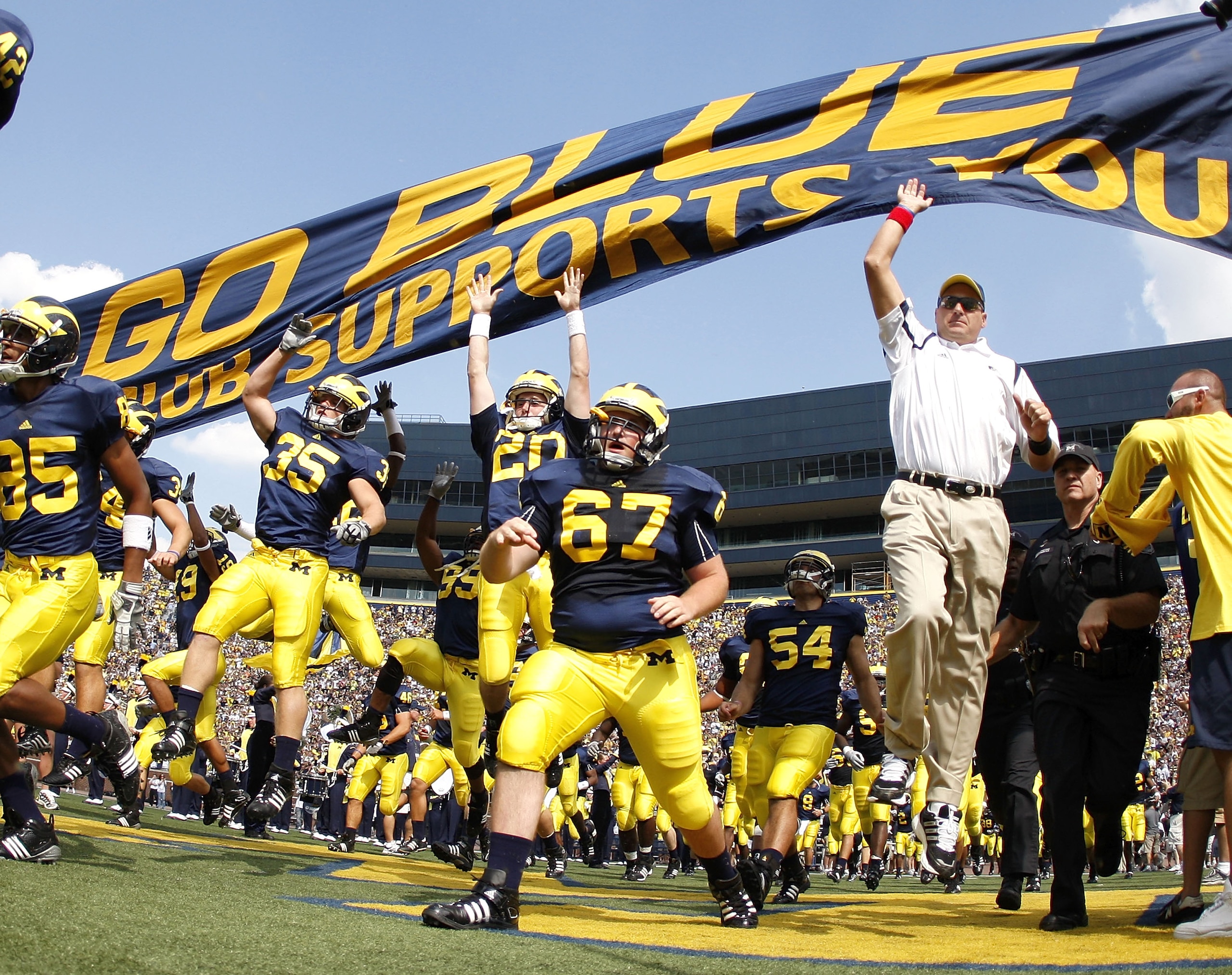 ANN ARBOR, MI - SEPTEMBER 05: Head coach Rich Rodriguez enters the stadium with his team prior to playing the Western Michigan Broncos on September 5, 2009 at Michigan Stadium in Ann Arbor, Michigan. (Photo by Gregory Shamus/Getty Images) ANN ARBOR, MI - SEPTEMBER 05: Head coach Rich Rodriguez enters the stadium with his team prior to playing the Western Michigan Broncos on September 5, 2009 at Michigan Stadium in Ann Arbor, Michigan. (Photo by Gregory Shamus/Getty Images)