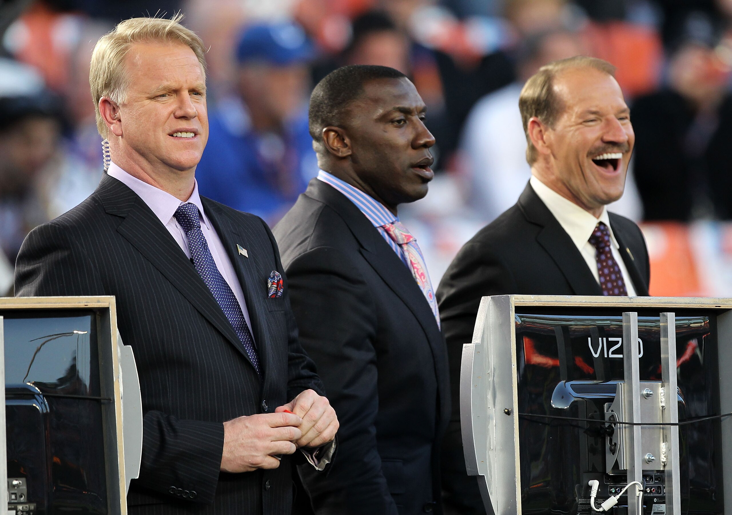 MIAMI GARDENS, FL - FEBRUARY 07:  Television personalities Boomer Esiason, Shannon Sharpe and Bill Cowher watch  warm ups prior to Super Bowl XLIV between the Indianapolis Colts and the New Orleans Saints on February 7, 2010 at Sun Life Stadium in Miami G