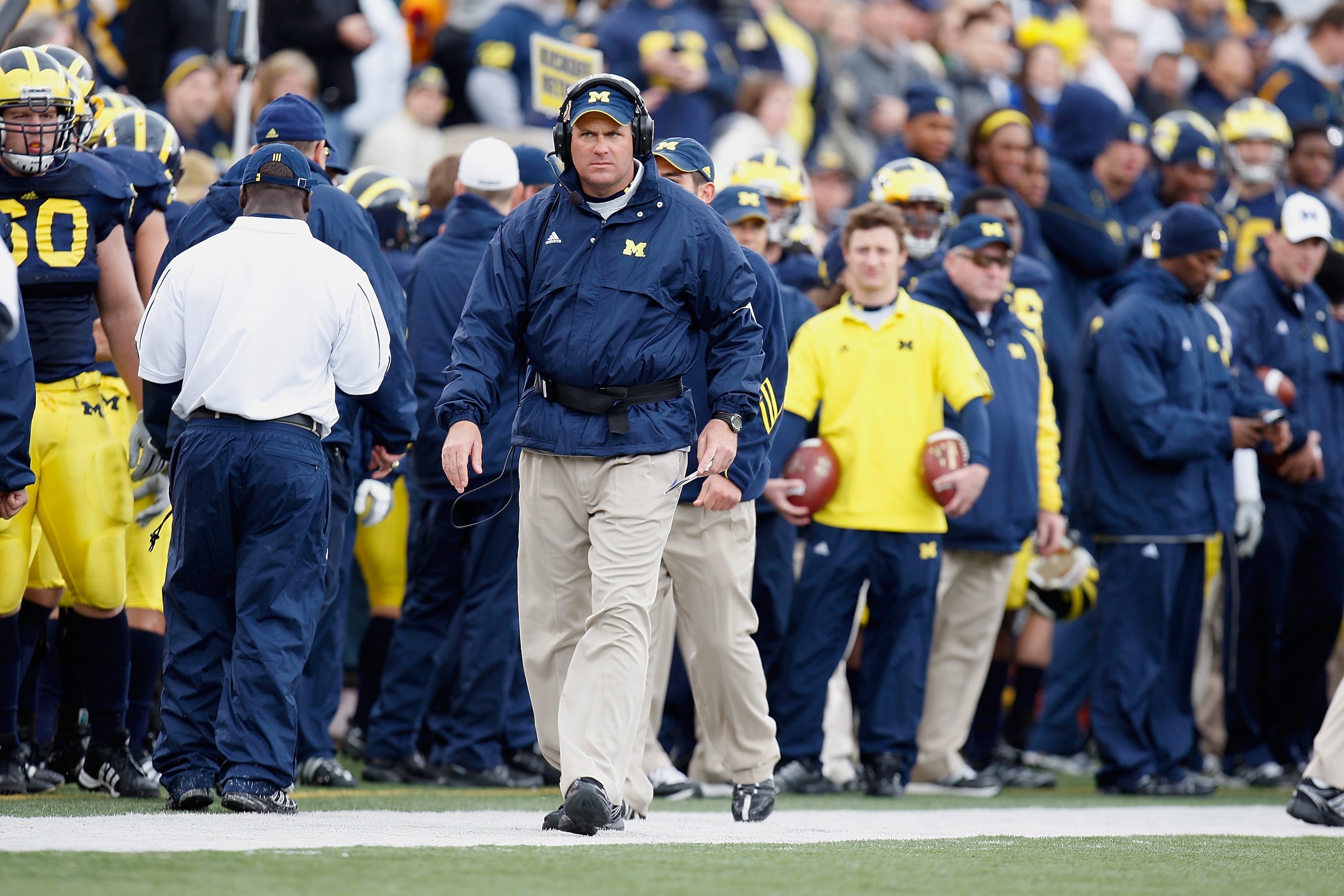 ANN ARBOR, MI - OCTOBER 25: Head Coach Rich Rodriguez of the Michigan Wolverines watches from the sidelines during the game against the Michigan State Spartans on October 25, 2008 at Michigan Stadium in Ann Arbor, Michigan. Michigan State won the game 35 ANN ARBOR, MI - OCTOBER 25: Head Coach Rich Rodriguez of the Michigan Wolverines watches from the sidelines during the game against the Michigan State Spartans on October 25, 2008 at Michigan Stadium in Ann Arbor, Michigan. Michigan State won the game 35