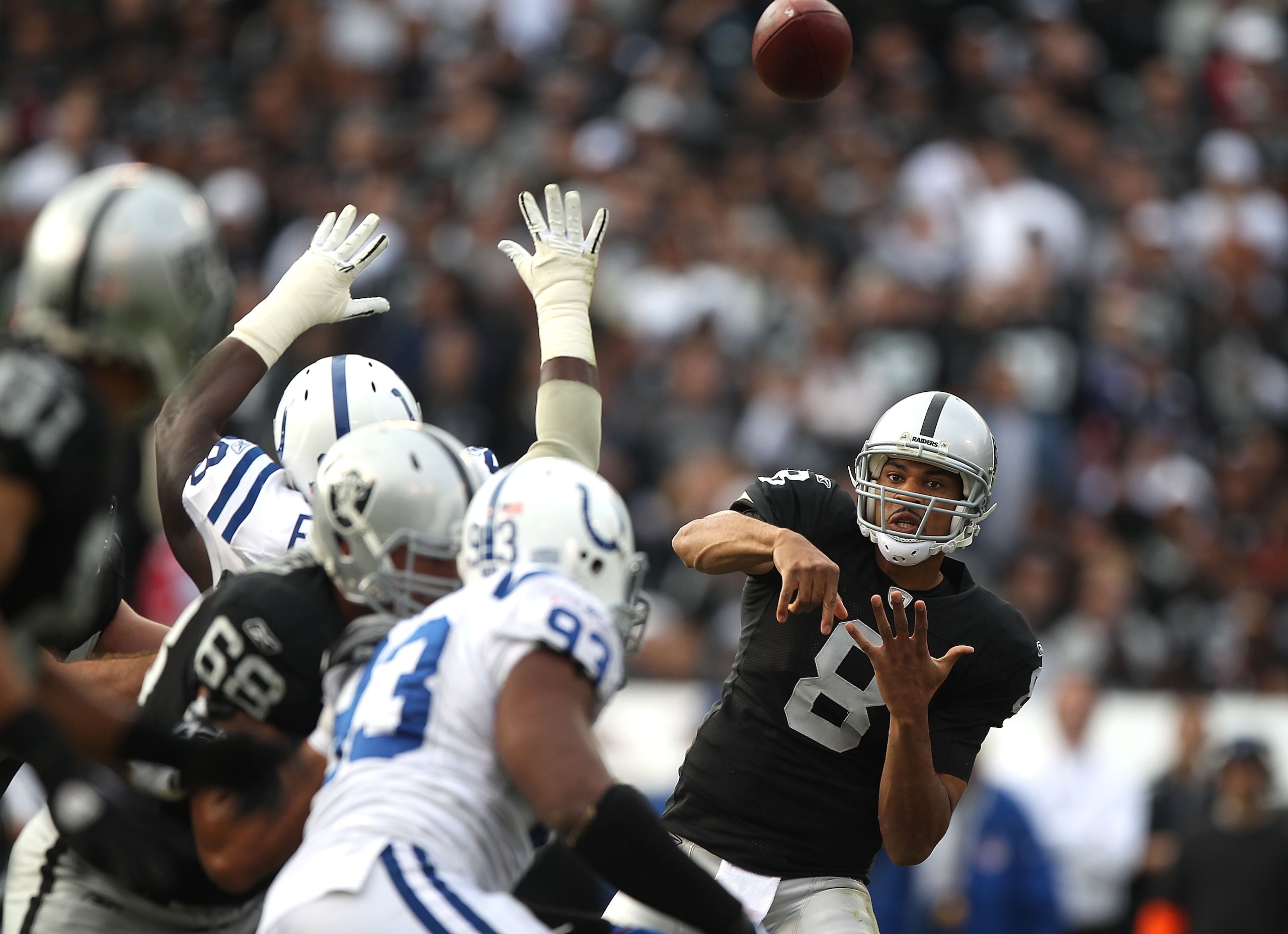 OAKLAND, CA - DECEMBER 26:  Jason Campbell #8 of the Oakland Raiders passes against the Indianapolis Colts during an NFL game at Oakland-Alameda County Coliseum on December  26, 2010 in Oakland, California.  (Photo by Jed Jacobsohn/Getty Images)