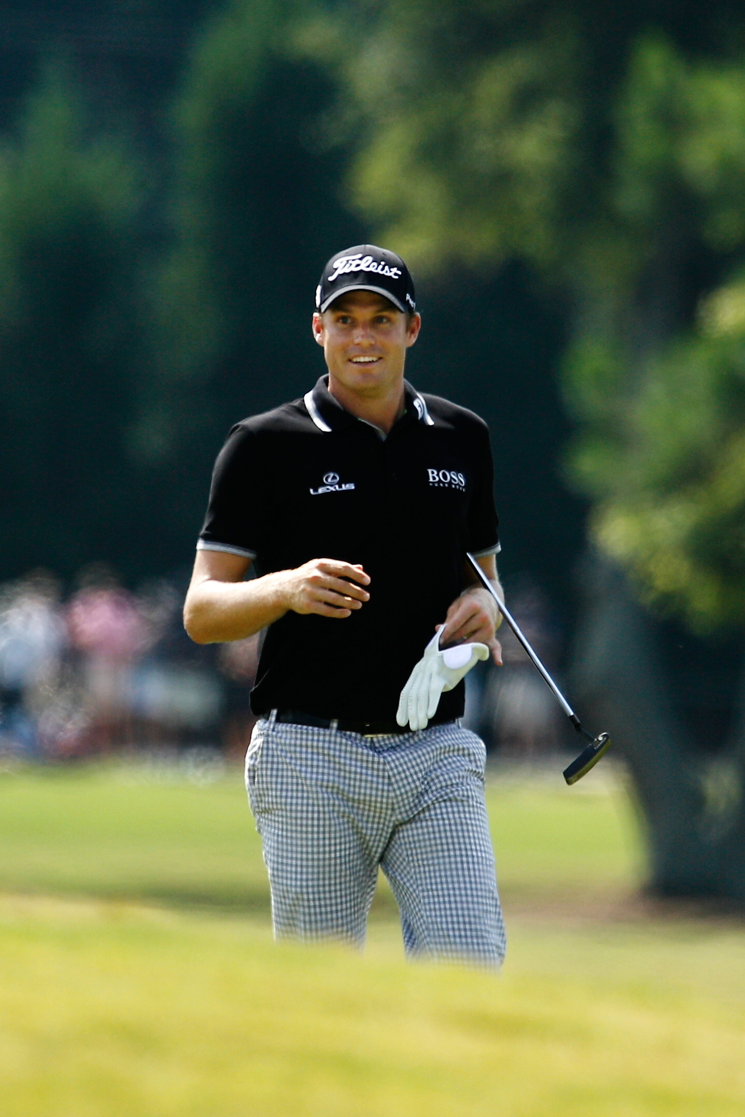 ATLANTA - SEPTEMBER 25:  Nick Watney smiles as he walks up the fairway after playing his second shot on the 17th hole during the third round of THE TOUR Championship presented by Coca-Cola at East Lake Golf Club on September 25, 2010 in Atlanta, Georgia.