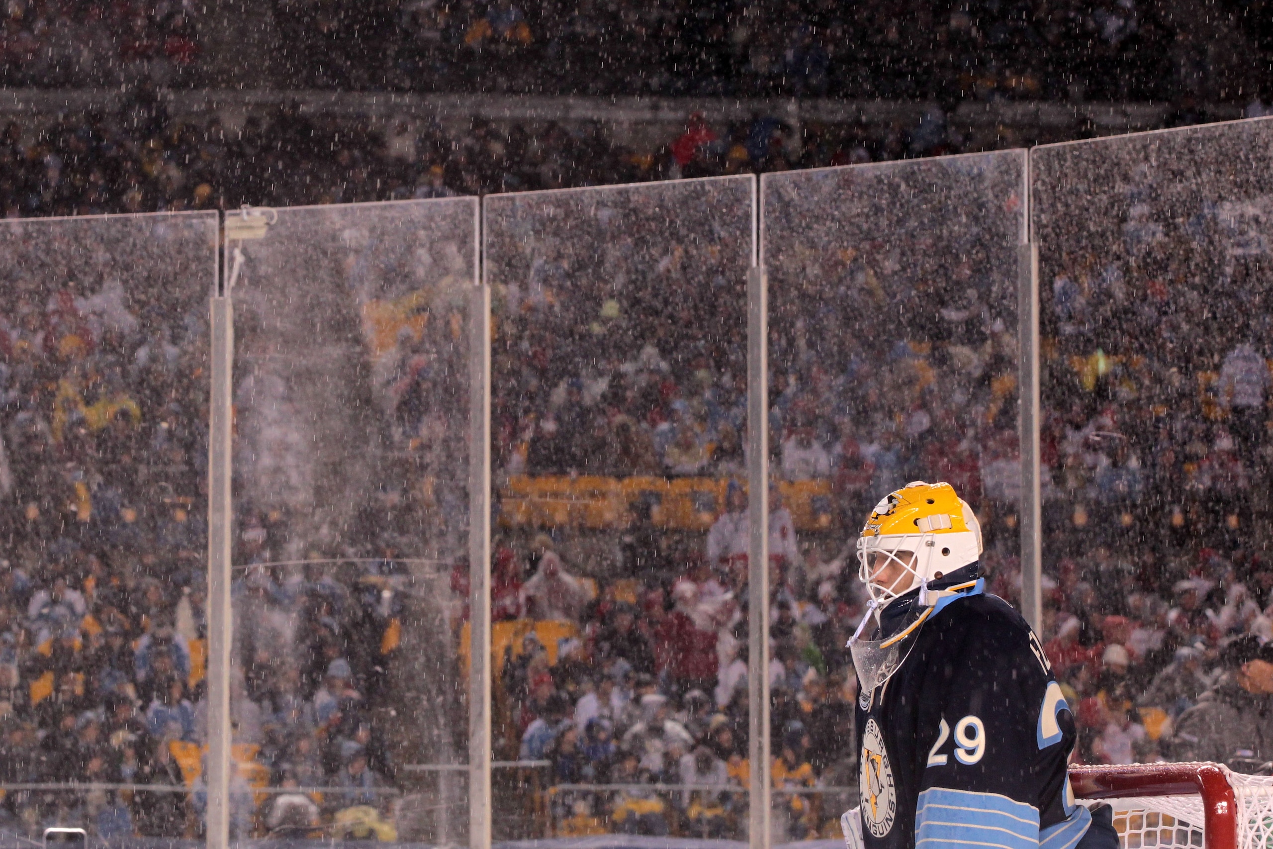 PITTSBURGH, PA - JANUARY 01:  Goalie Marc-Andre Fleury #29 of the Pittsburgh Penguins looks on from the net in the rain during the 2011 NHL Bridgestone Winter Classic against the Washington Capitals at Heinz Field on January 1, 2011 in Pittsburgh, Pennsyl