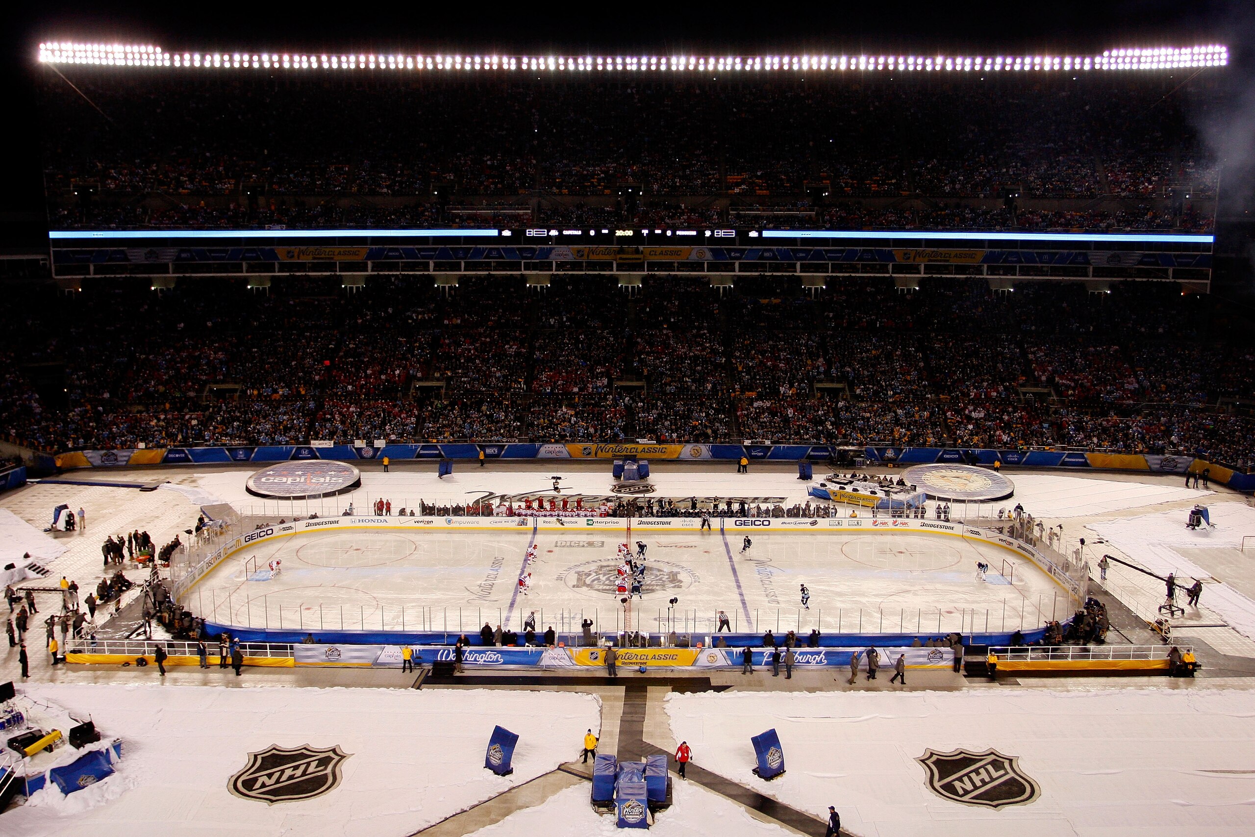 PITTSBURGH, PA - JANUARY 01:  The Washington Capitals and the Pittsburgh Penguins faceoff at the start of the 2011 NHL Bridgestone Winter Classic at Heinz Field on January 1, 2011 in Pittsburgh, Pennsylvania.  (Photo by Justin K. Aller/Getty Images)