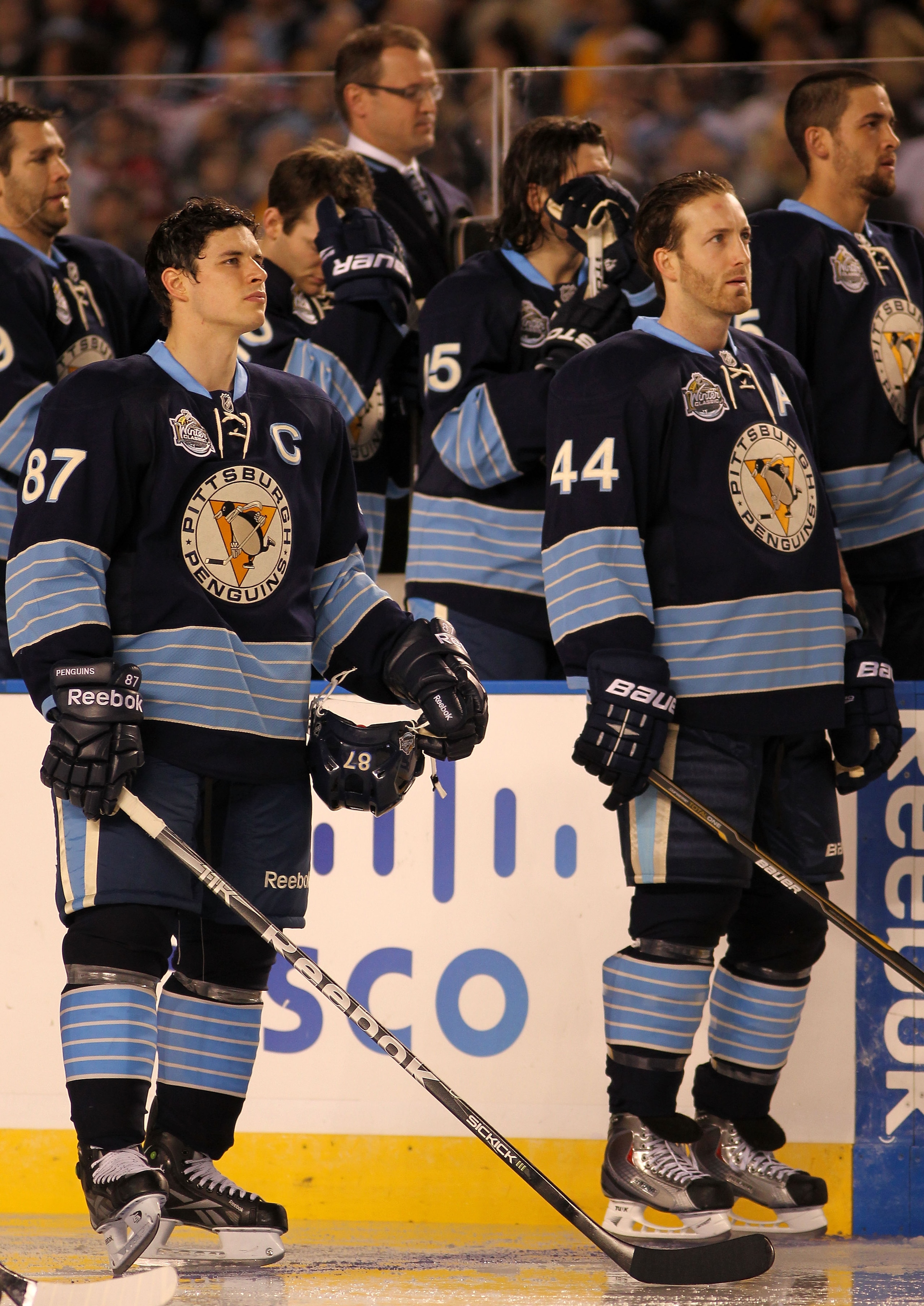 PITTSBURGH, PA - JANUARY 01: Captain Sidney Crosby #87 and Brooks Orpik #44 of the Pittsburgh Penguins look on during the singing of the national anthem before playing against the Washington Capitals in the 2011 NHL Bridgestone Winter Classic at Heinz Fi PITTSBURGH, PA - JANUARY 01: Captain Sidney Crosby #87 and Brooks Orpik #44 of the Pittsburgh Penguins look on during the singing of the national anthem before playing against the Washington Capitals in the 2011 NHL Bridgestone Winter Classic at Heinz Fi