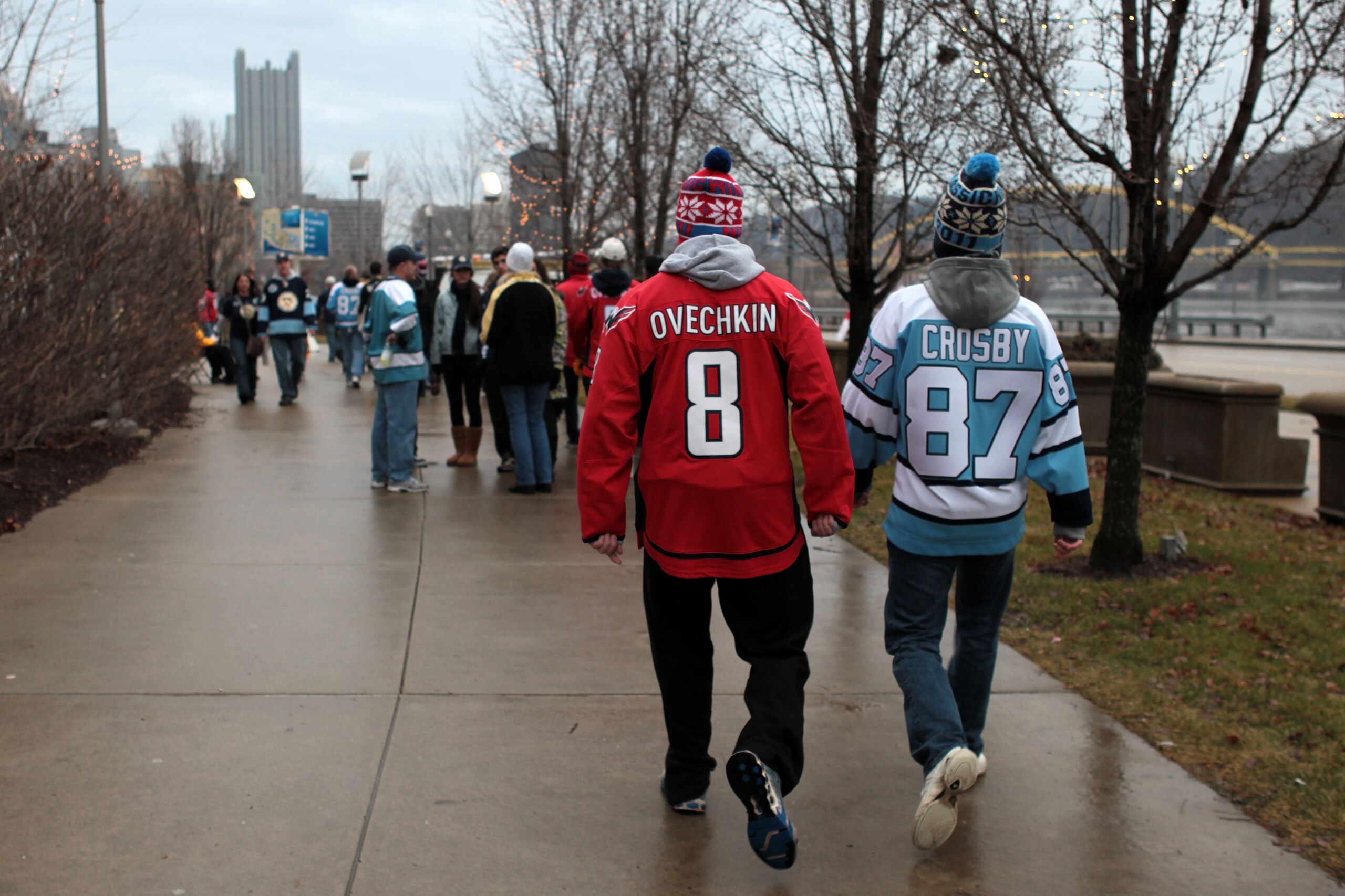 PITTSBURGH, PA - JANUARY 01: A fan of the Washington Captials wears an 'Ovechkin' jersey while walking alongside a fan of the Pittsburgh Penguins wearing a 'Crosby' jersey prior to the start of the 2011 NHL Bridgestone Winter Classic at Heinz Field on Ja PITTSBURGH, PA - JANUARY 01: A fan of the Washington Captials wears an 'Ovechkin' jersey while walking alongside a fan of the Pittsburgh Penguins wearing a 'Crosby' jersey prior to the start of the 2011 NHL Bridgestone Winter Classic at Heinz Field on Ja