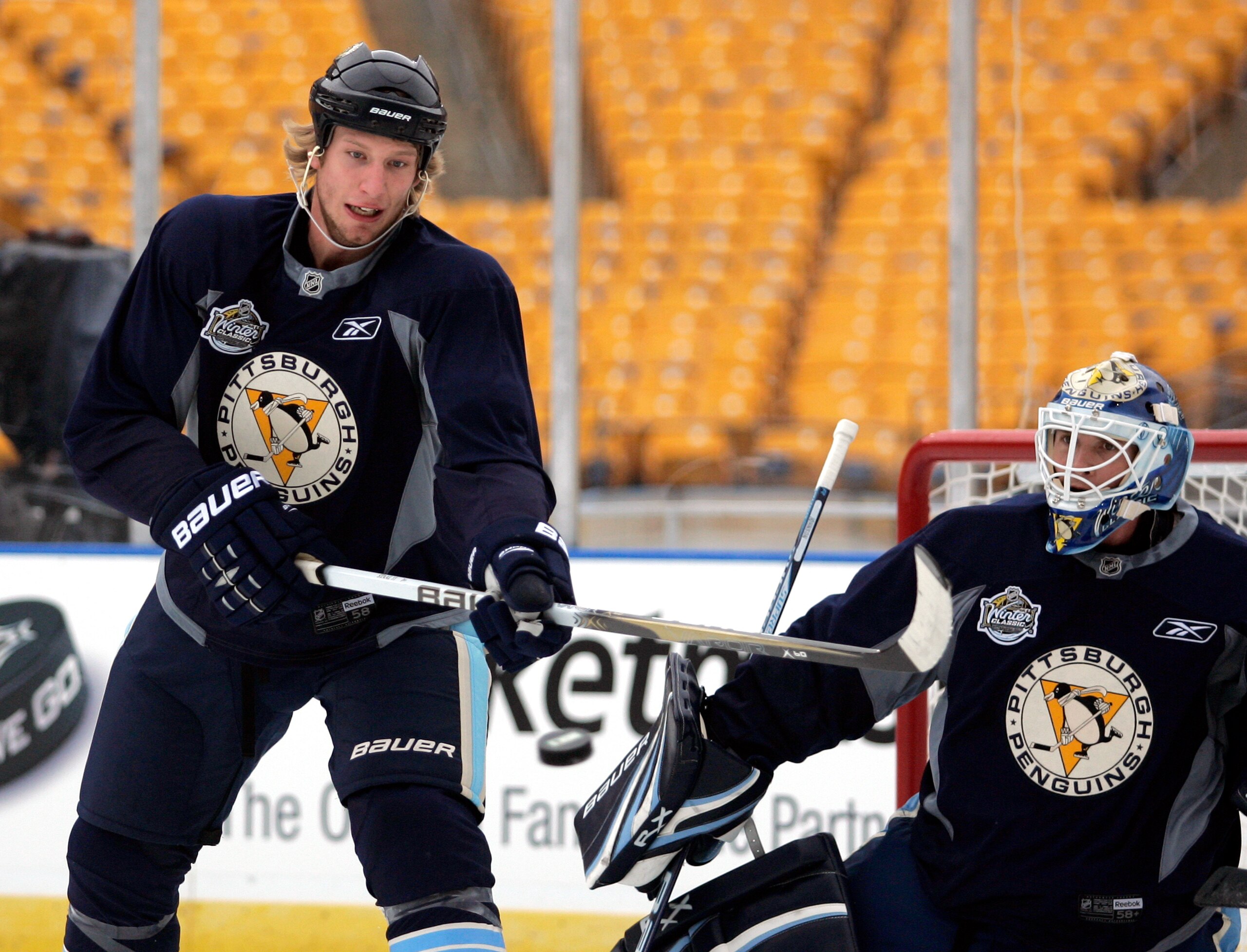 PITTSBURGH, PA - DECEMBER 31:  Jordan Staal #11 of the Pittsburgh Penguins deflects a puck on Brent Johnson #1 during the 2011 NHL Winter Classic Practice on December 31, 2010 at Heinz Field in Pittsburgh, Pennsylvania.  (Photo by Justin K. Aller/Getty Im