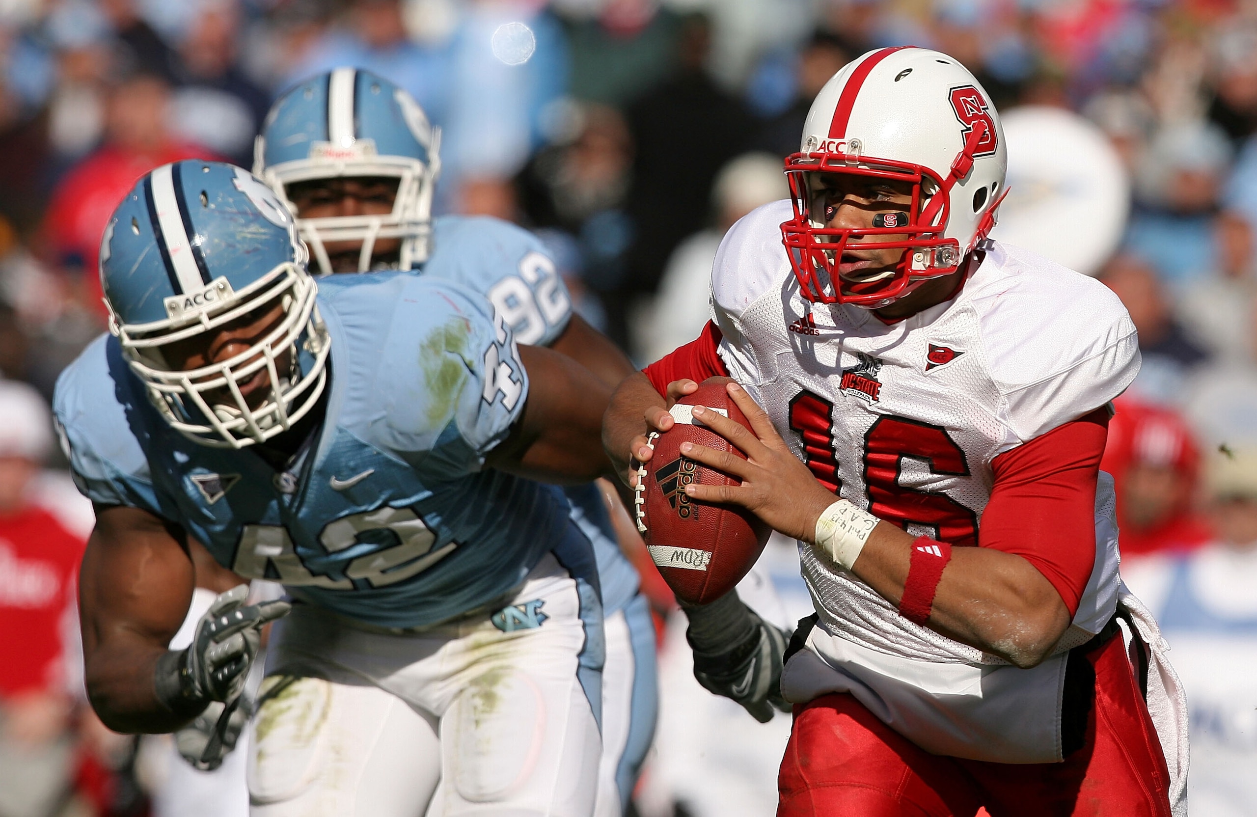 CHAPEL HILL, NC - NOVEMBER 22: Robert Quinn #42 of the North Carolina Tar Heels tries to chase down Russell Wilson #16 of the North Carolina State Wolfpack at Kenan Stadium on November 22, 2008 in Chapel Hill, North Carolina. (Photo by Streeter Lecka/Ge CHAPEL HILL, NC - NOVEMBER 22: Robert Quinn #42 of the North Carolina Tar Heels tries to chase down Russell Wilson #16 of the North Carolina State Wolfpack at Kenan Stadium on November 22, 2008 in Chapel Hill, North Carolina. (Photo by Streeter Lecka/Ge