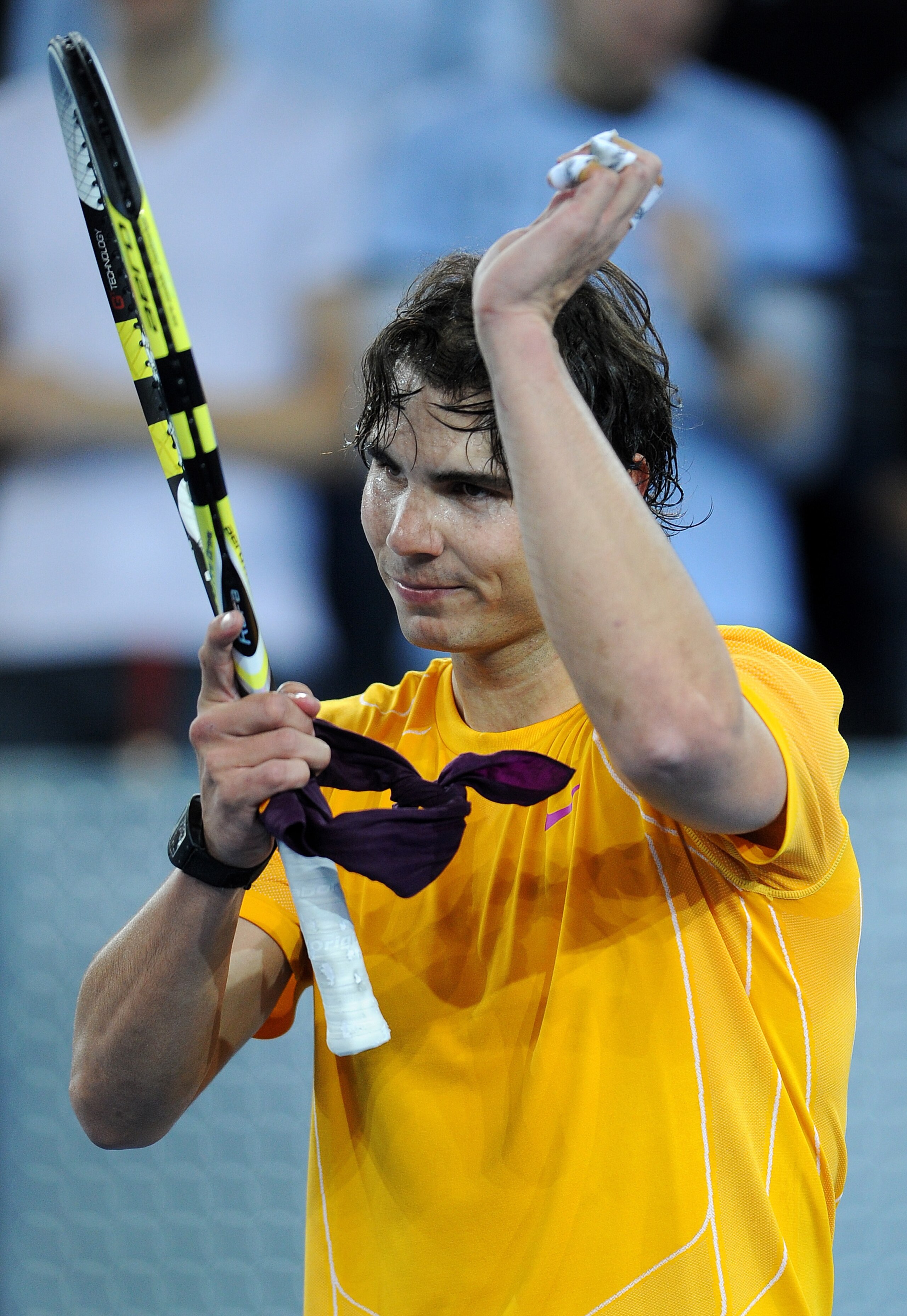 MADRID, SPAIN - DECEMBER 22:  Rafael Nadal of Spain reacts at the end of a charity exhibition match against Roger Federer of Switzerland at La Caja Magica on December 22, 2010 in Madrid, Spain.  (Photo by Jasper Juinen/Getty Images)