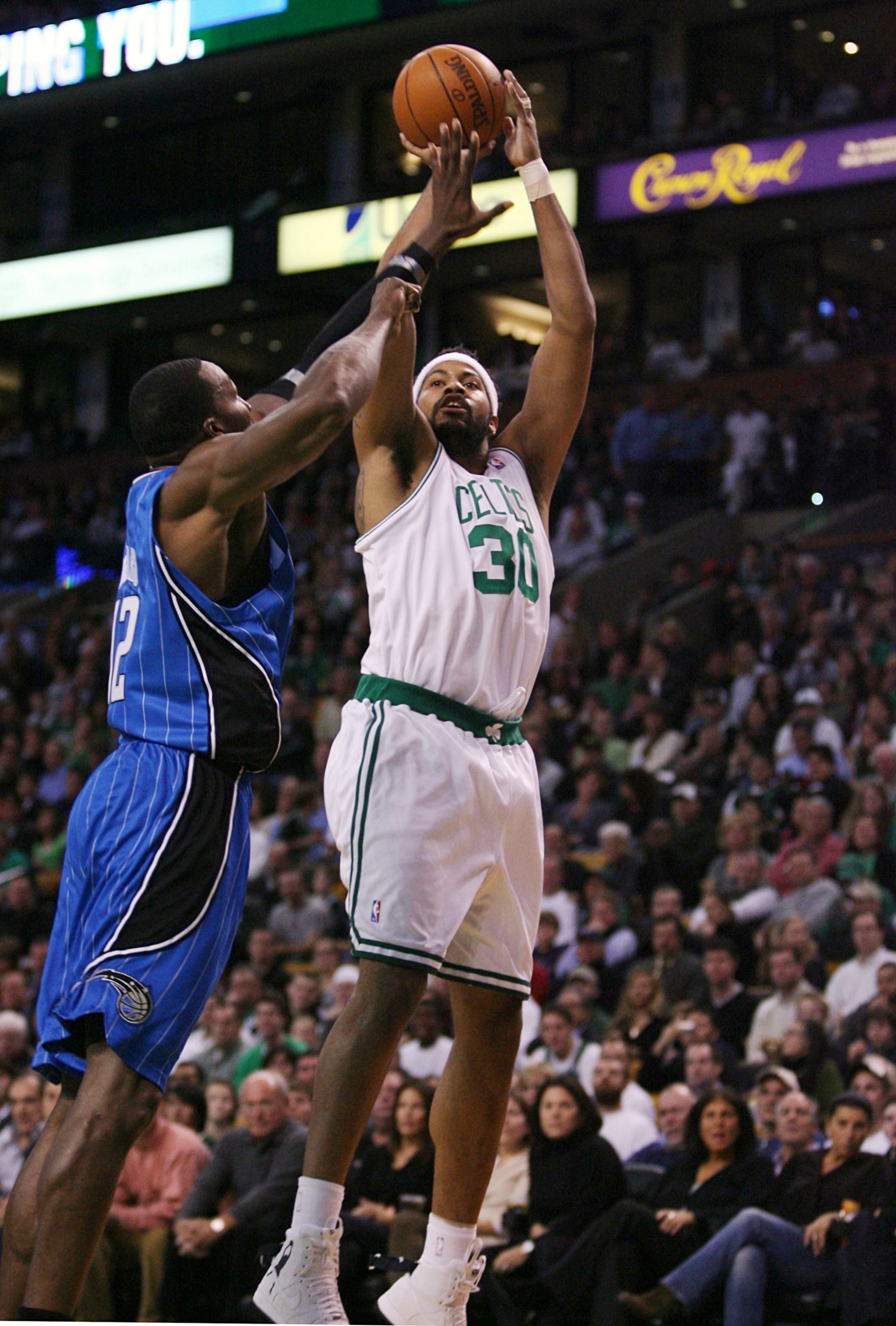 BOSTON - NOVEMBER 20: Rasheed Wallace #30 of the Boston Celtics shoots a jumper against Dwight Howard #12 of the Orlando Magic during the game on November 20, 2009 at the TD Garden in Boston, Massachusetts. NOTE TO USER: User expressly acknowledges and ag