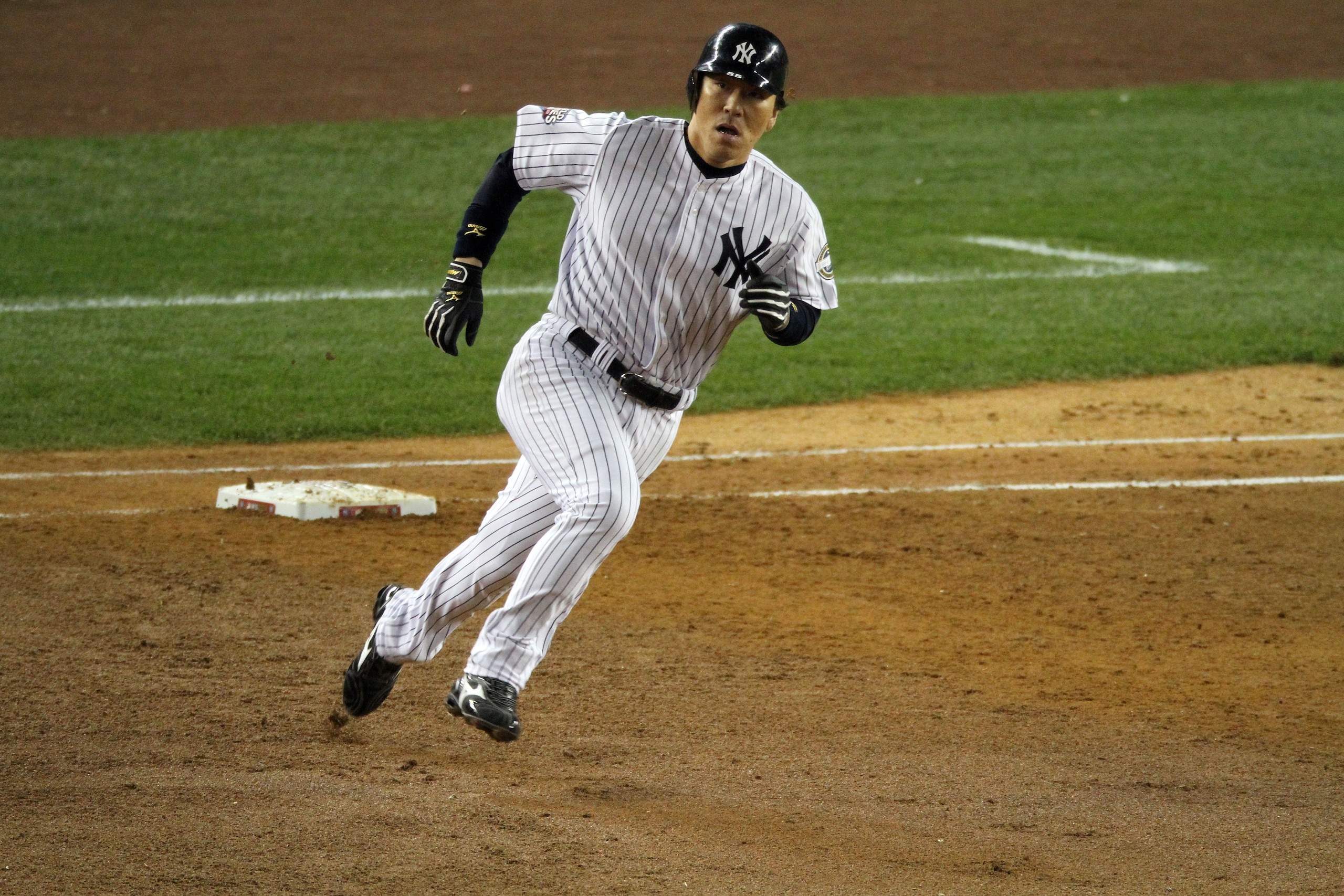 NEW YORK - NOVEMBER 04:  Hideki Matsui #55 of the New York Yankees rounds firts base on his 2-run double in the bottom of the fifht inning against the Philadelphia Phillies in Game Six of the 2009 MLB World Series at Yankee Stadium on November 4, 2009 in