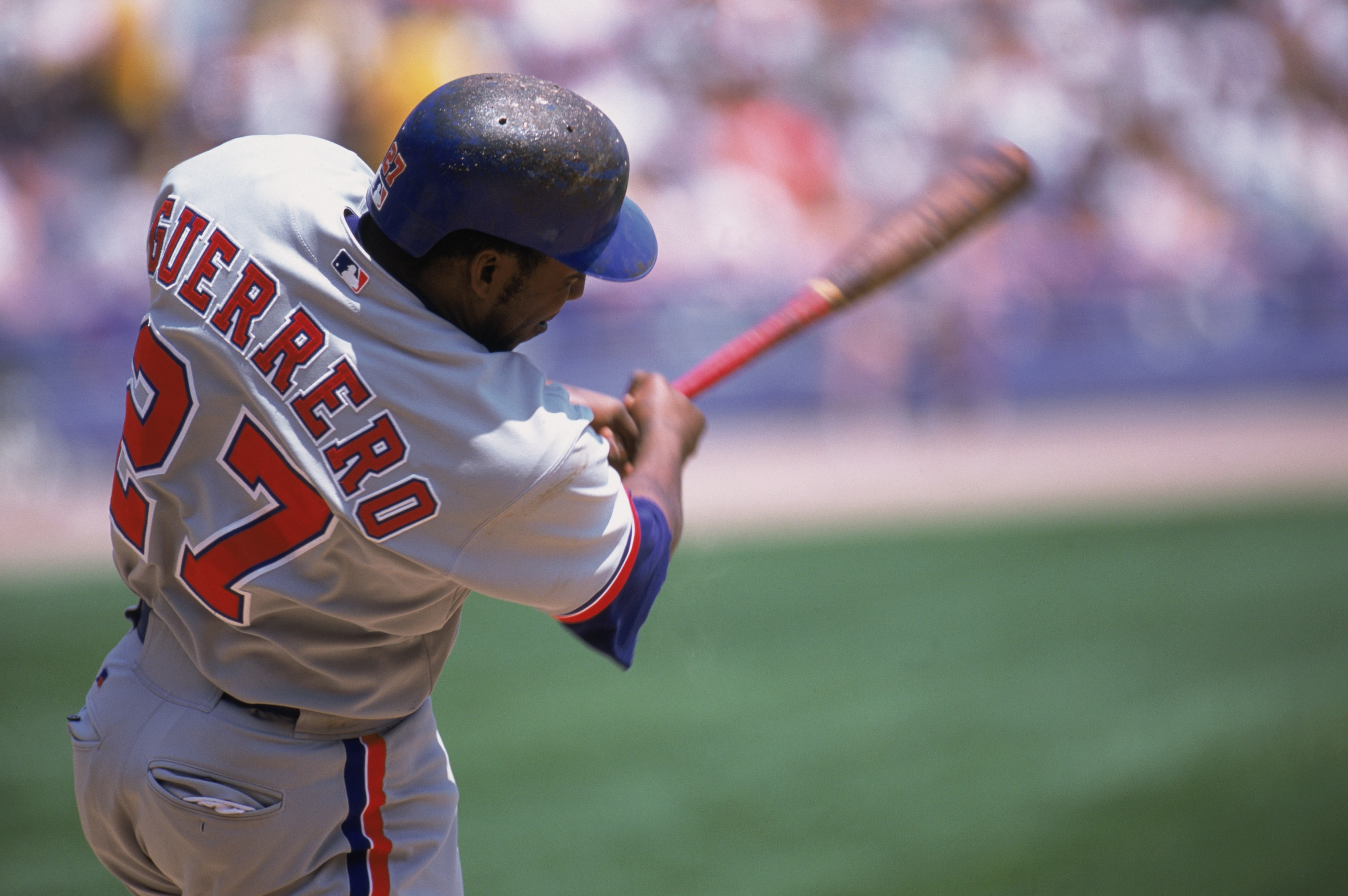 CHICAGO - JUNE 19:  Right fielder Vladimir Guerrero #27 of the Montreal Expos swings at the pitch during the MLB game against the Chicago White Sox at Comiskey Park in Chicago, Illinois on June 9, 2002. The White Sox defeated the Expos 13-2. (Photo by Jon
